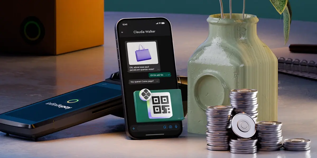 Smartphone exibindo uma conversa de compra com QR code na tela, sugerindo pagamento via Pix no WhatsApp. Ao lado, pilhas de moedas e um vaso decorativo.