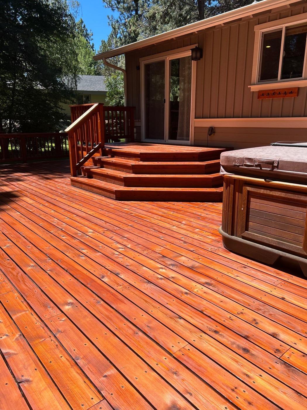 Deck and steps sanded and stained a deep cedar tone