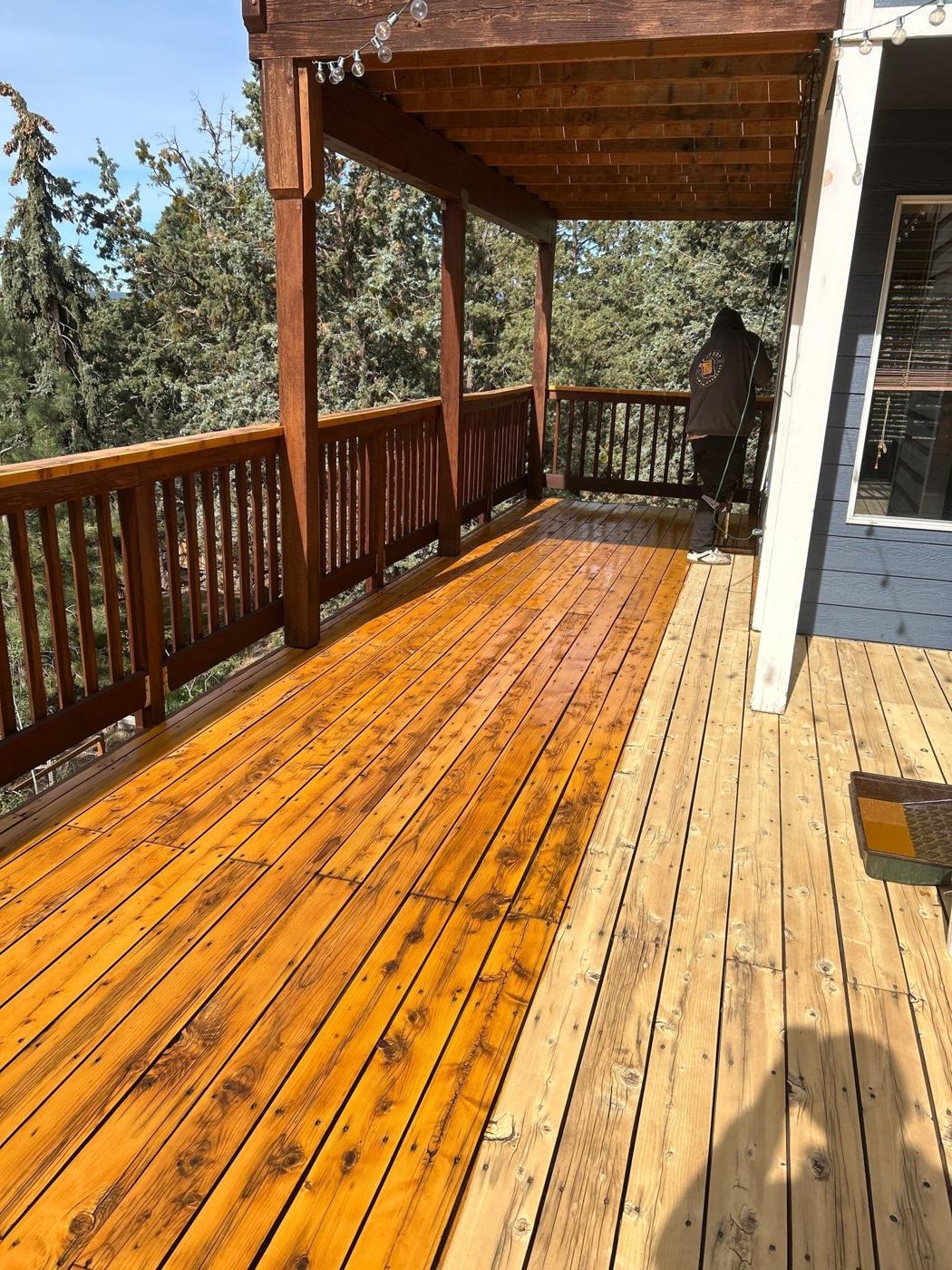 Covered porch deck with freshly stained cedar boards