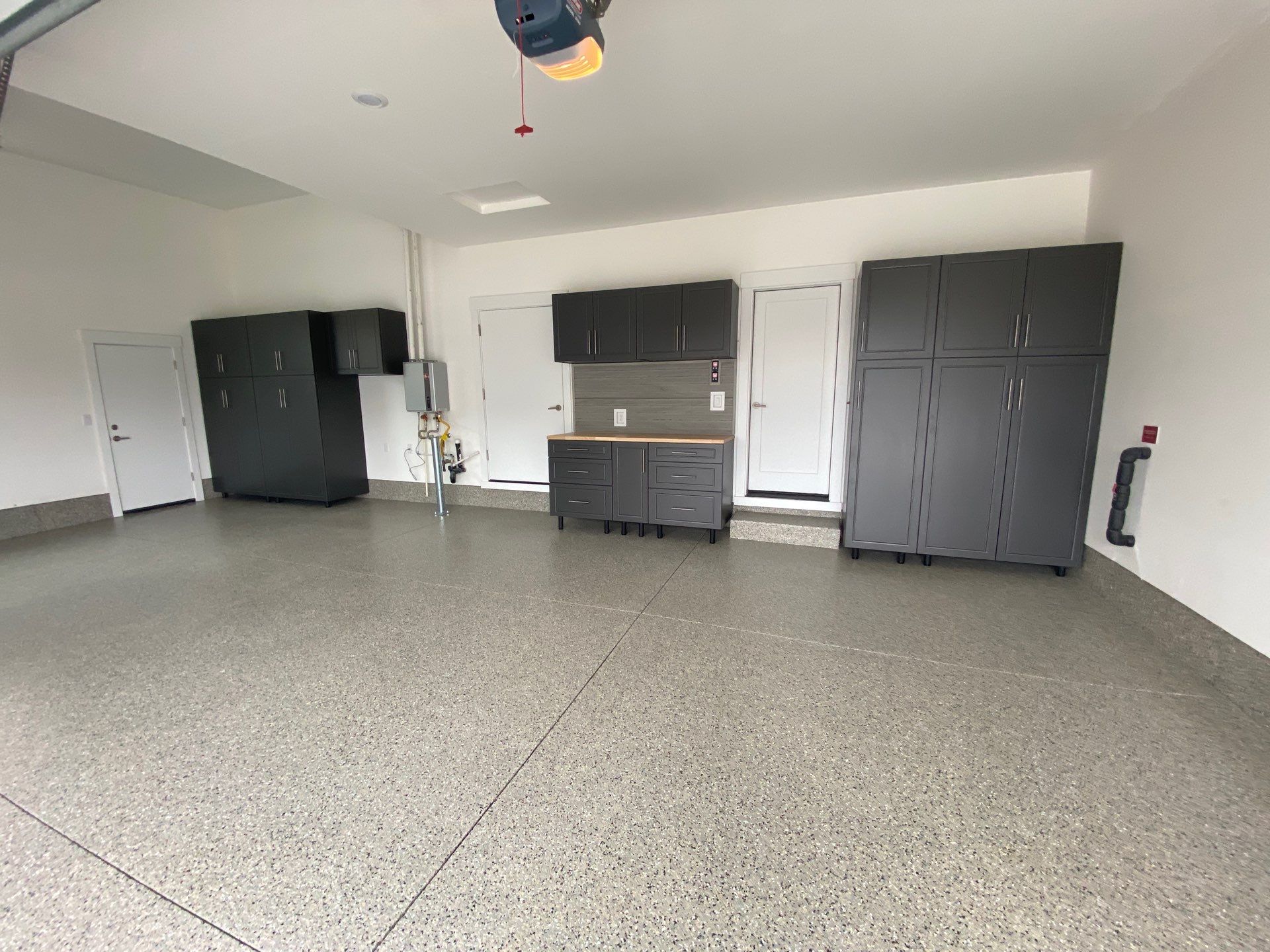 Garage Transformation in Bend, OR: Polyurea Coating, Custom Cabinets, and Slatwall