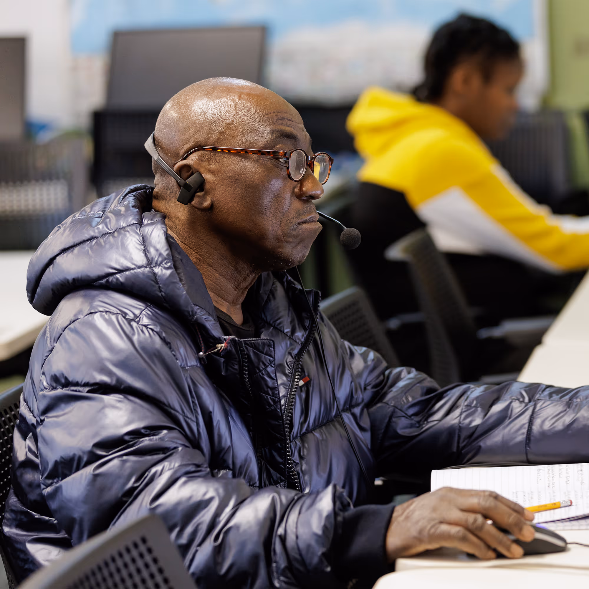 A male Goodwill Excel Center student working on a certification