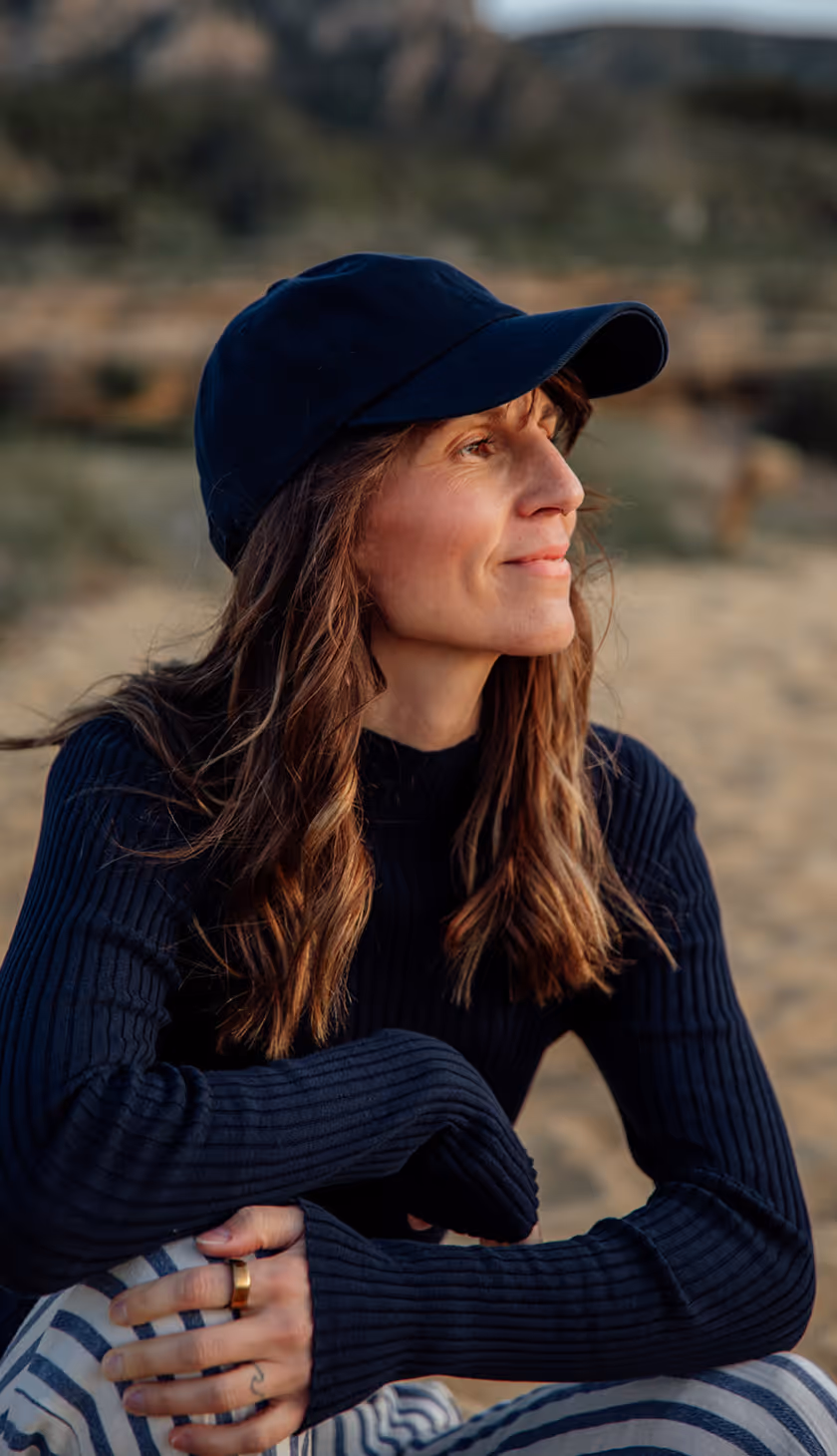 Julie Breiert, Founder of SomaSoul reaching her hands up