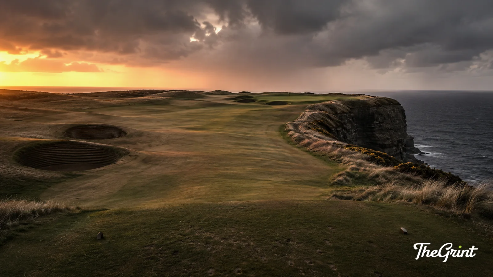 Clifftop links golf hole at sunset with the ocean beyond
