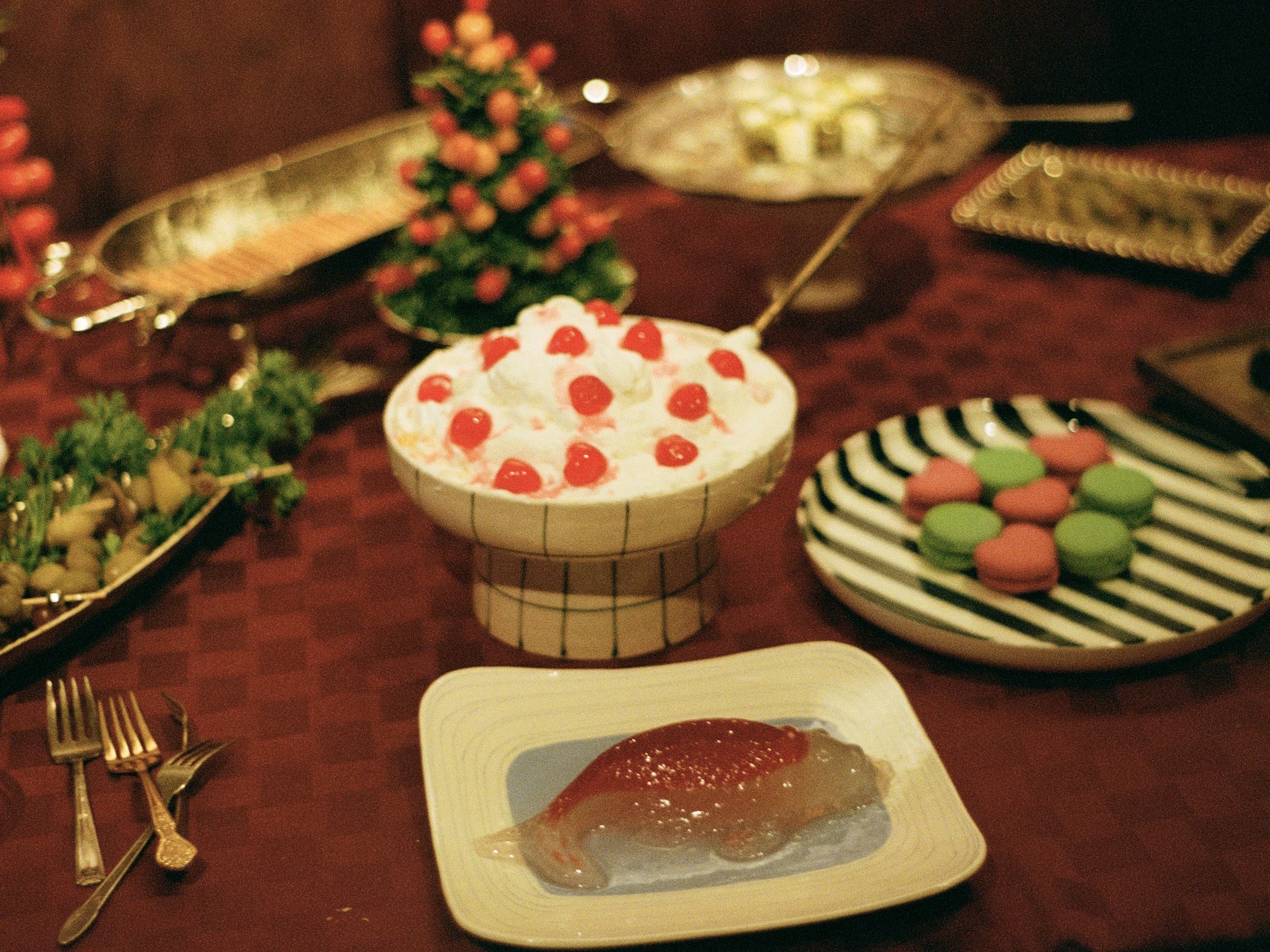 image of a 70s inspired tablescape, complete with jell-o fish and maraschino ambrosia salad