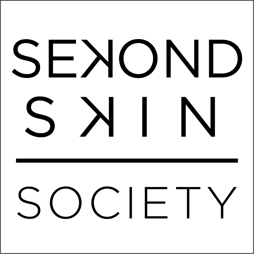 Logo design featuring the words "SECOND SKIN" in large, bold, uppercase letters, with "SOCIETY" below in smaller letters, all centered within a rectangular border.