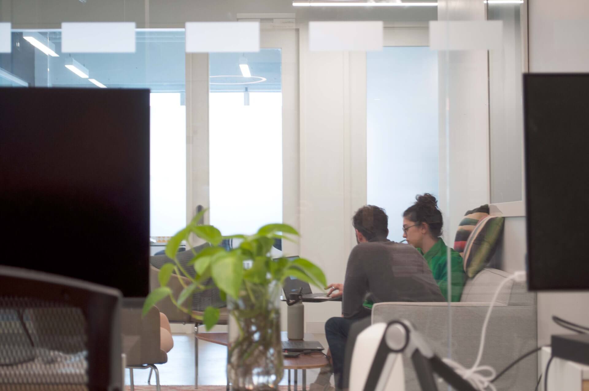 Punctuate Design office with two people speaking about product development and design
