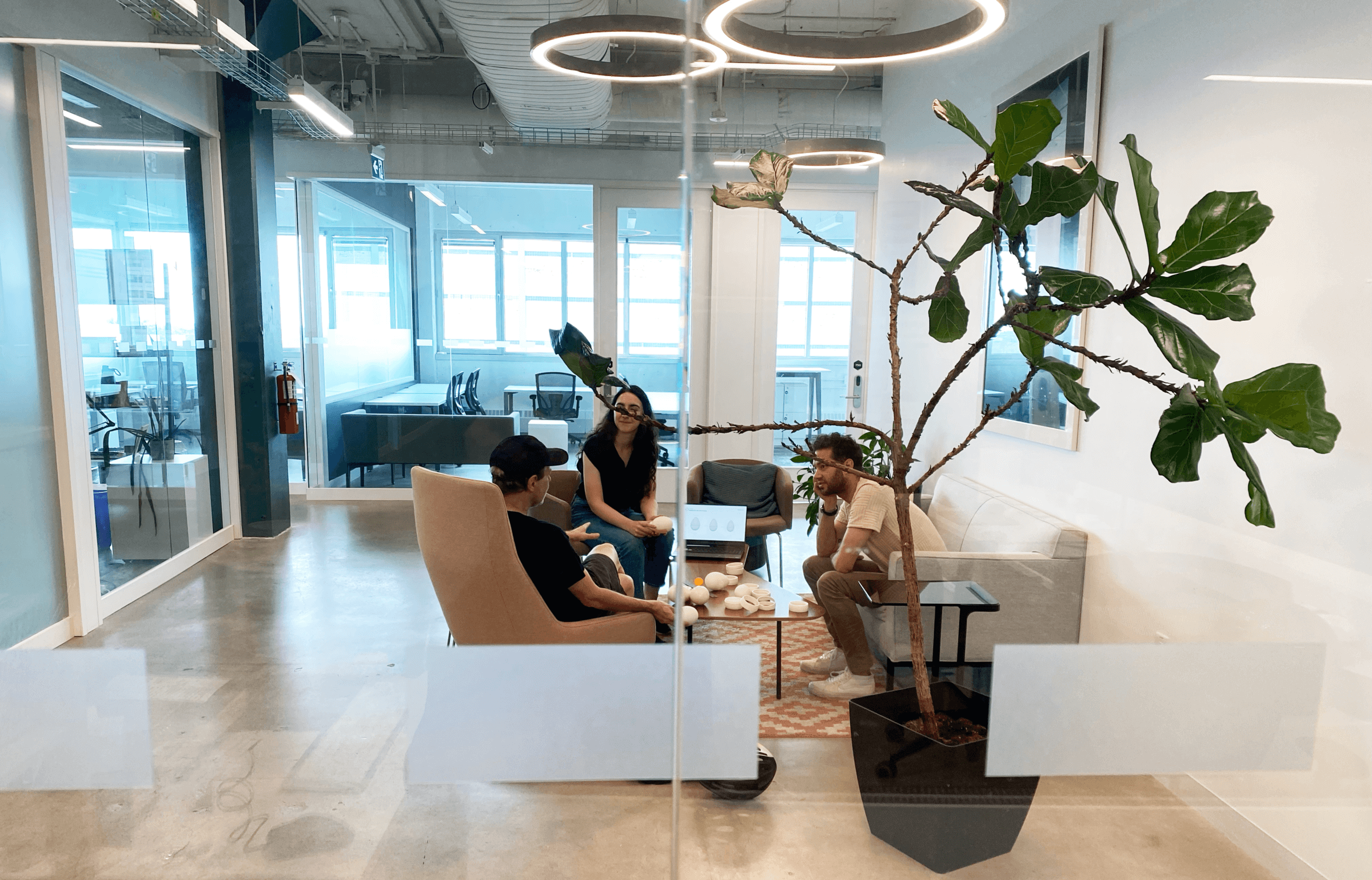 Punctuate Design team collaborating during the EurekIA product development process in a modern studio.