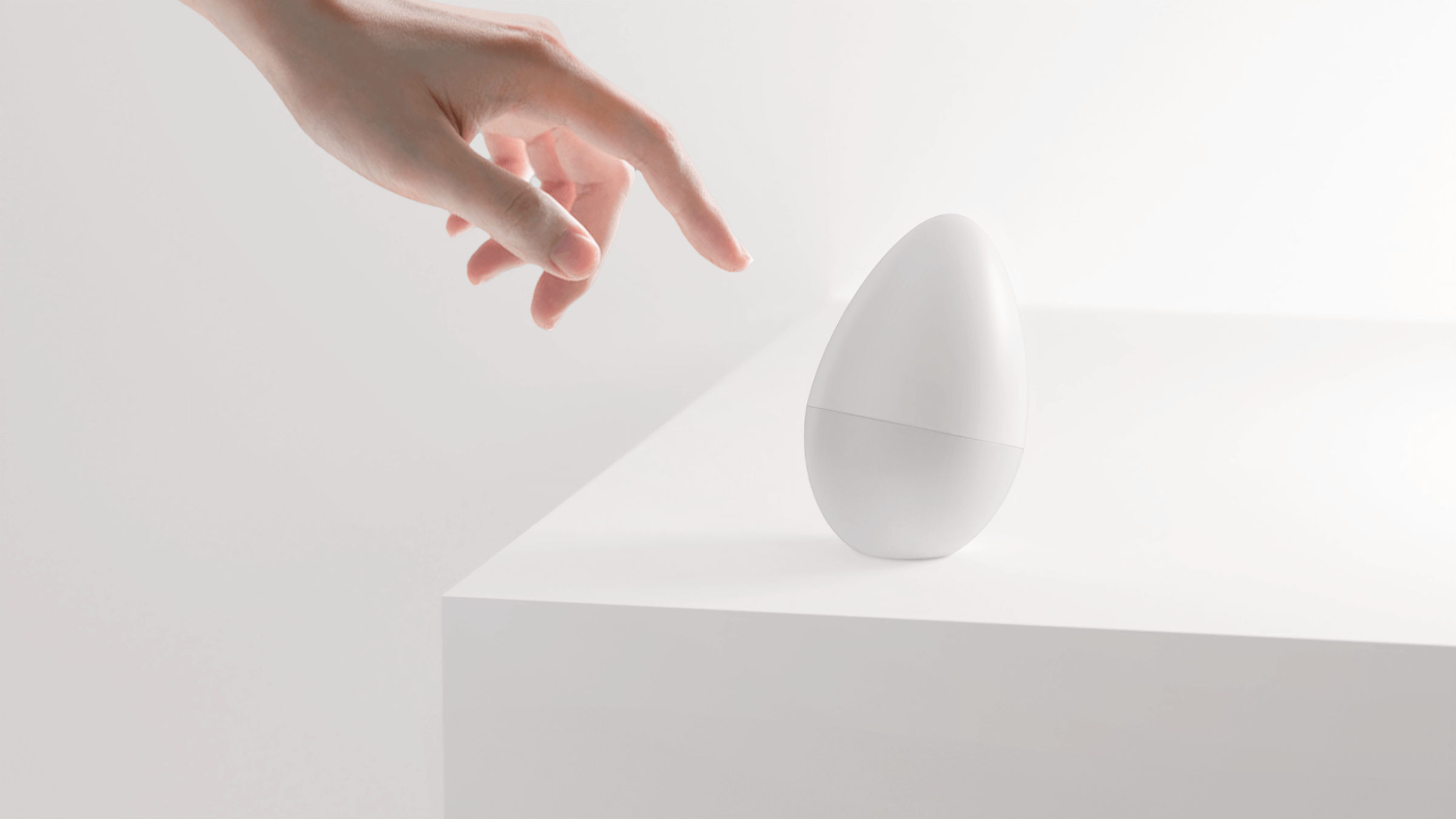 User interacting with the EurekIA smart device, showcasing minimal industrial design and consumer electronics development.