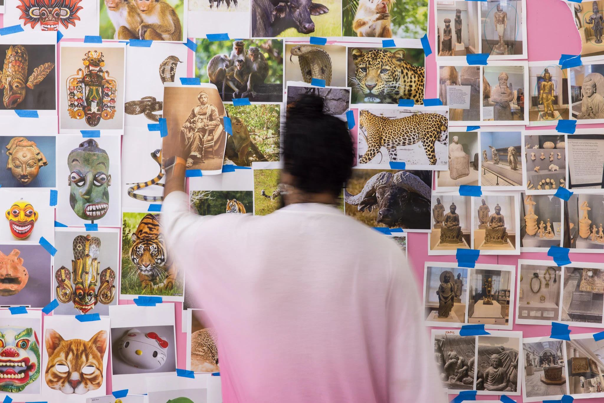 (Previous page) Ramesh's reference board plastered with A4 printouts of Barbie and her modular wardrobes, photographs of big cats in the wild, and images of Gandhara Buddhas and with Hello Kitty.