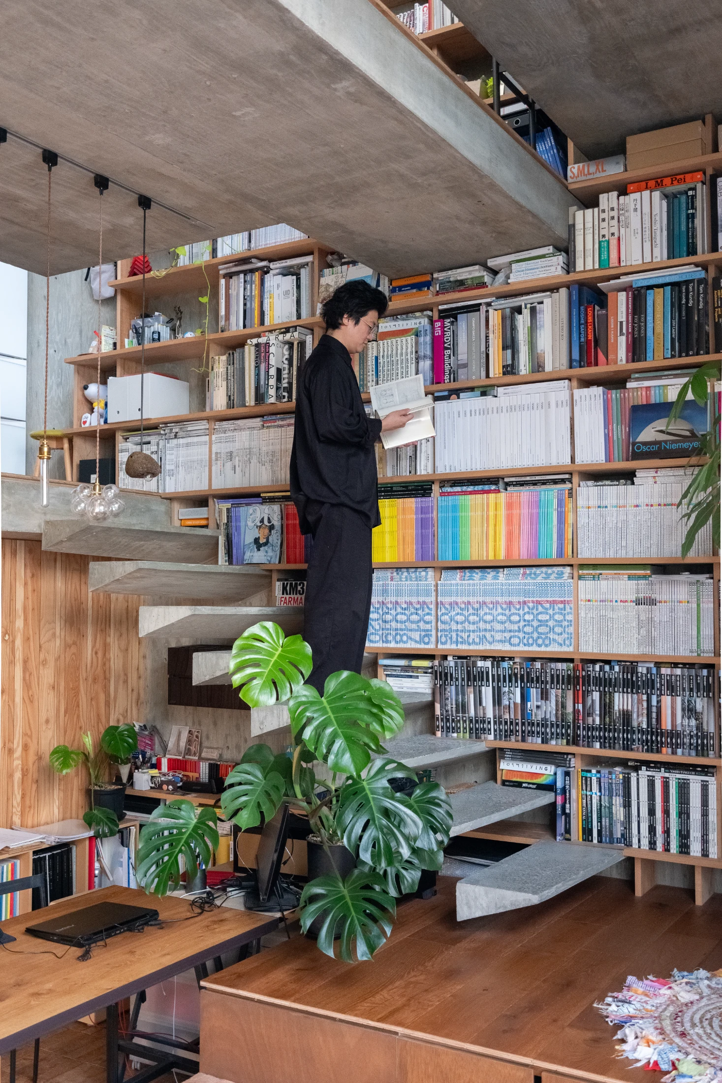 Masato with his collection of roughly 5000 books.