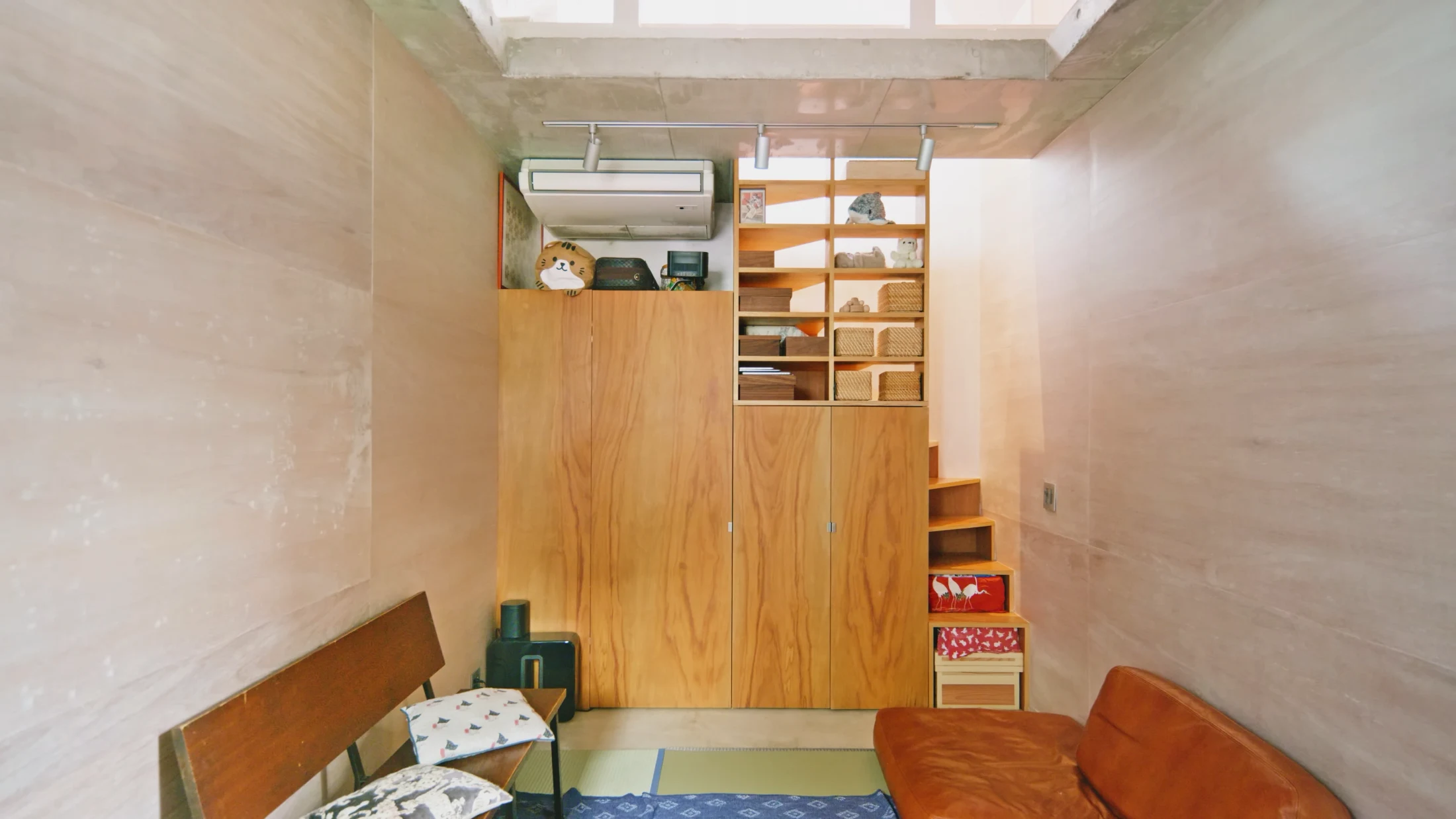 At Flagpole House in Tokyo, designed by Motoki Yasuhara of SALHAUS, double-sided open shelving allows easy access to everyday items with the help of some baskets and boxes that also double as storage and allow clutter-free access. Image: Never Too Small.