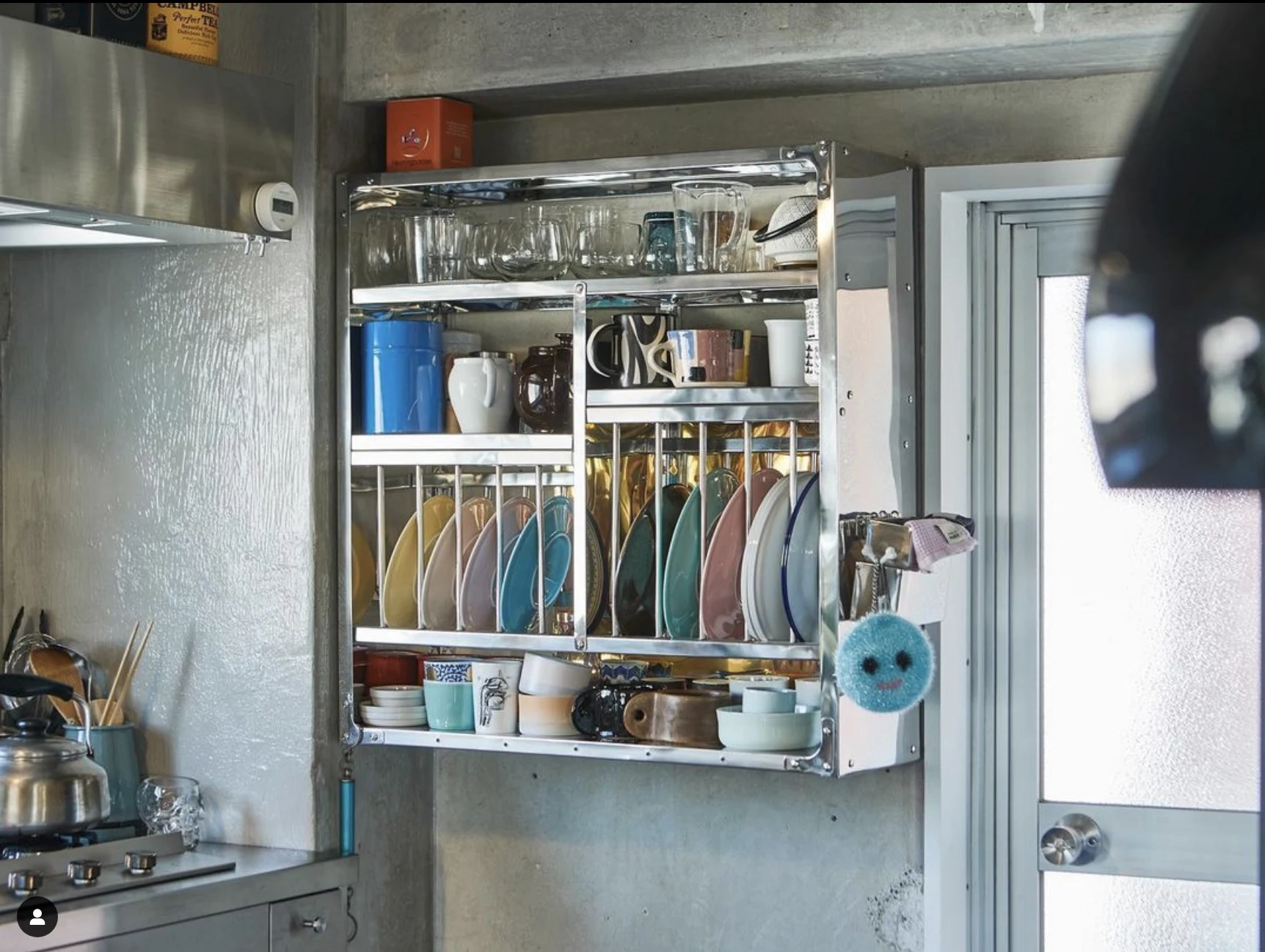 The stainless steel 'Indian Plate Rack' by David HAY is the ideal storage solution in Koichi and David's stainless-steel-heavy kitchen at Roovice (see page 72), designed by Kei Makito of Nakamura Akira. Image: Akira Nakamura.