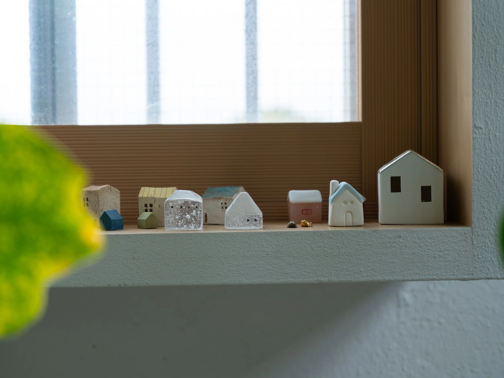 (ABOVE) Quaint collections of tiny houses appear on high shelves and window sills in Somo Somo House (see page 84) Image: Nam Tran.