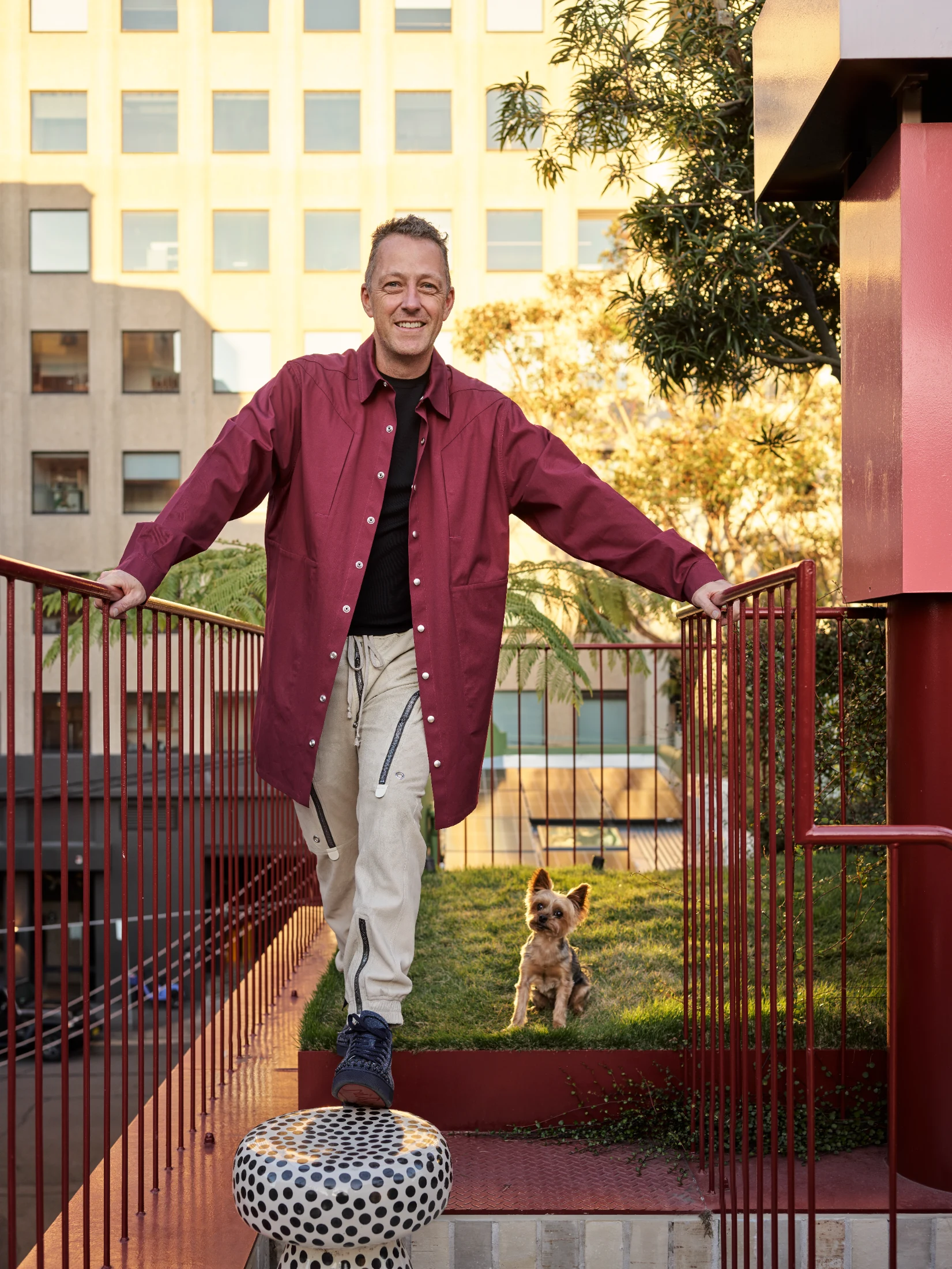 Adam Haddow and his Yorkshire Terrier, Eric on their rooftop garden.