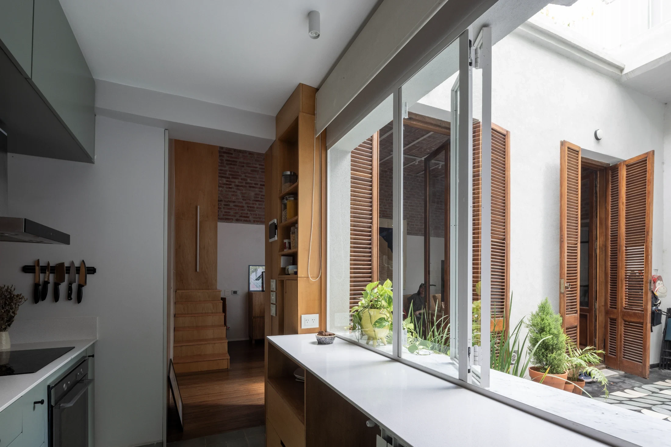 The redesigned floorplan improves circulation between the living spaces, kitchen and patio.