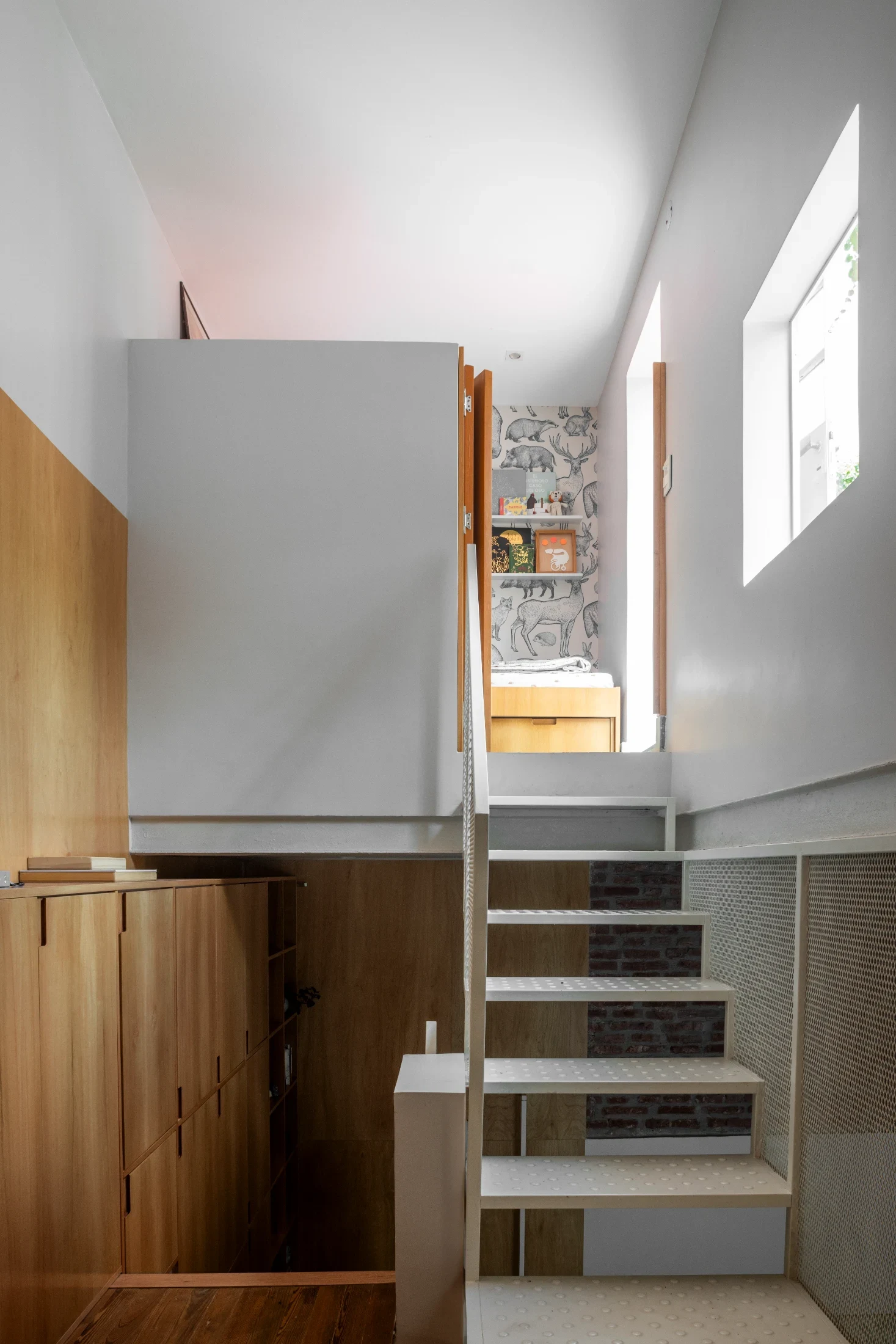 Pedro's bedroom is accessed via the top flight of stairs from Laura and Juan's bedroom.