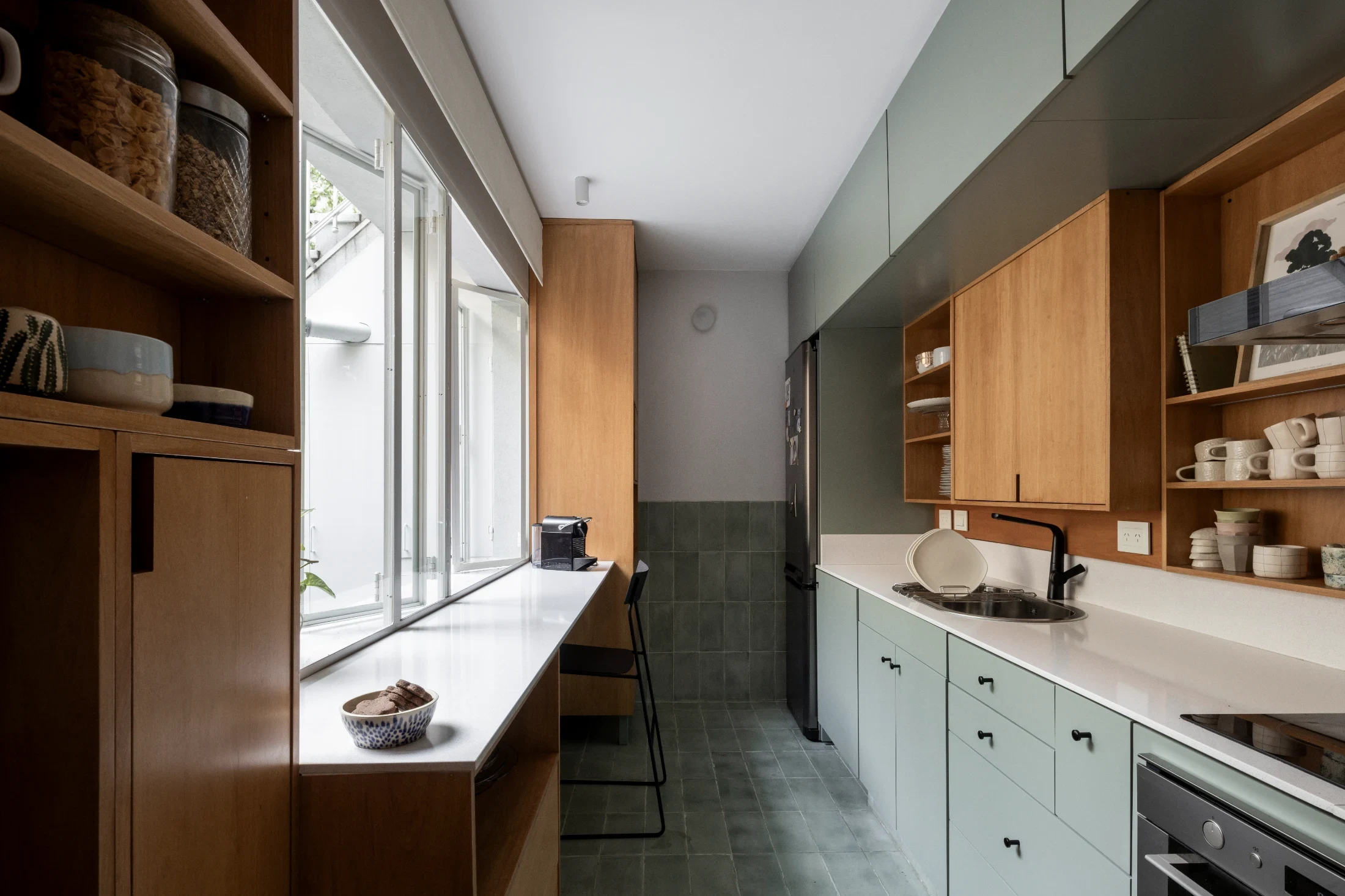The spacious kitchen includes a breakfast bar that also doubles as a servery window opening onto the patio.