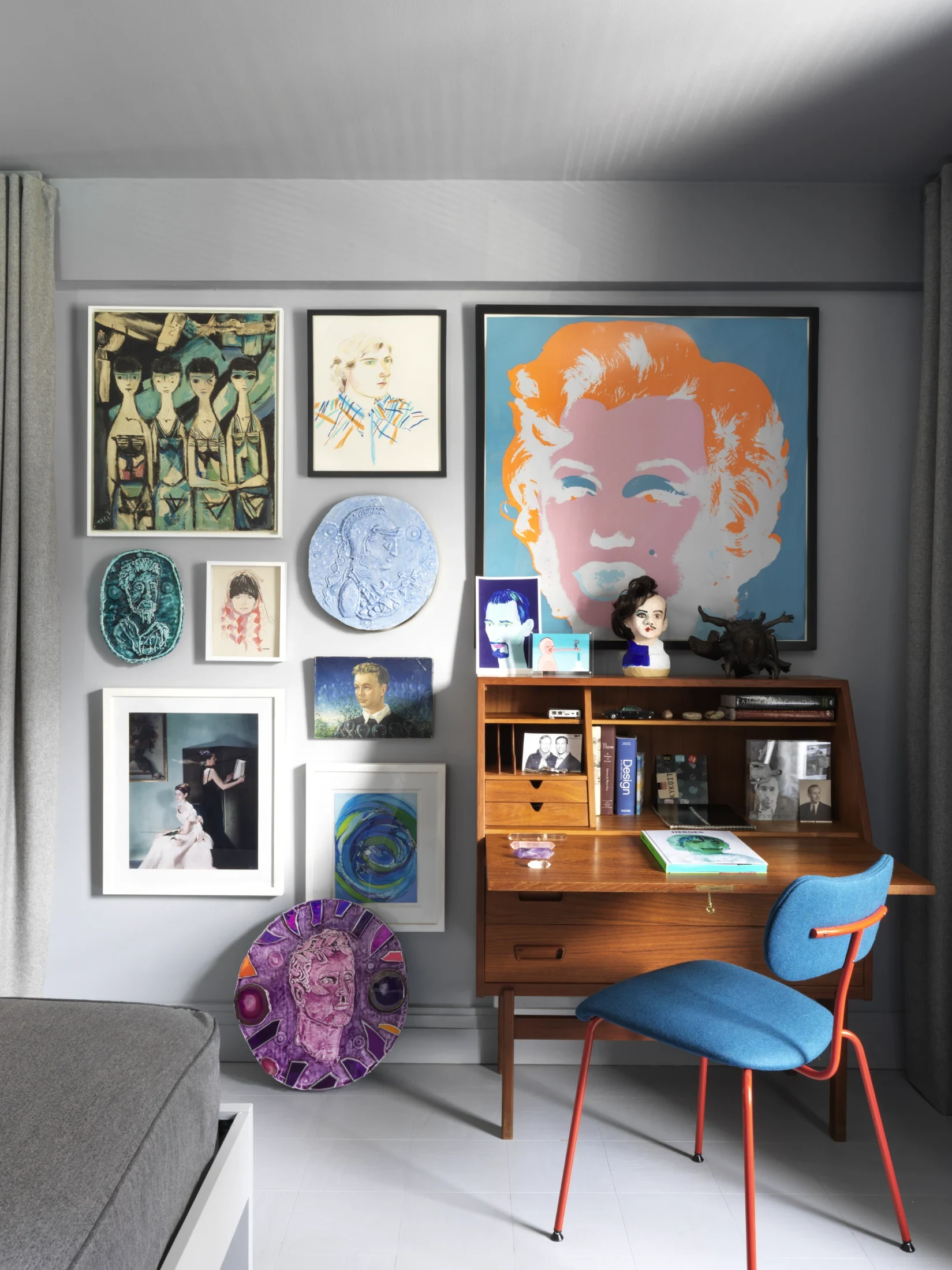 All of the artworks pictured are by Doug, except for the pink papier mâché bust of the woman on the left on the bottom shelf, which dates from the the 1960s and is from the Andy Warhol's collection. The framed picture is one of the limited-edition works fr