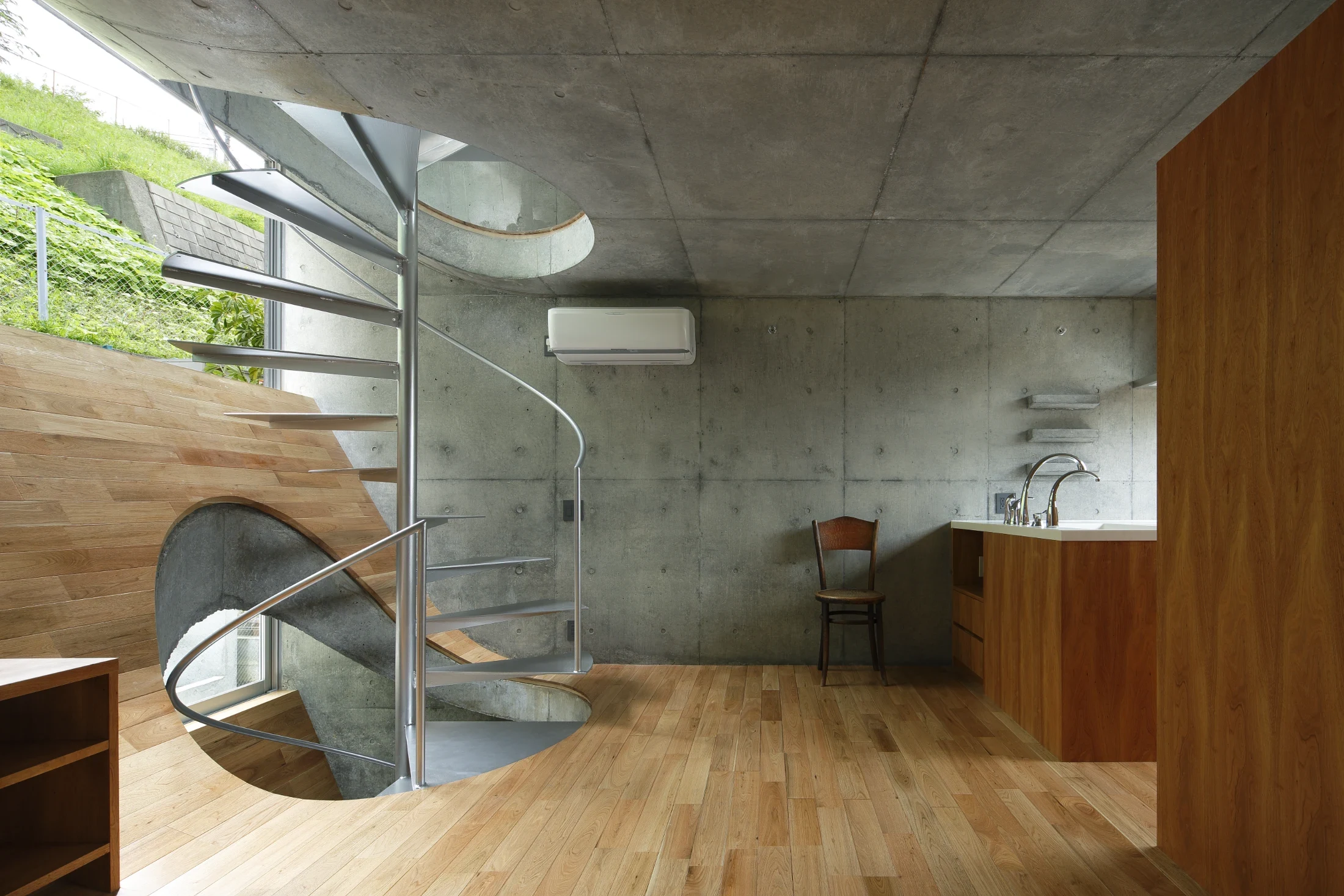 Takeshi's sense of play is evident in his design for House in Byobugaura (2012) that bids residents and visitors to climb up and slide down its timber lined concrete slopes. Image: Nacasa & Partners Inc.