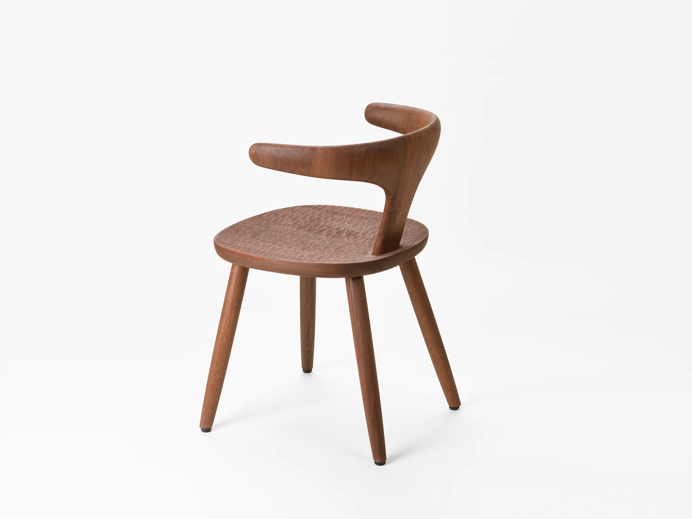 The Bunna Chair, designed by Naoto Fukasawa for Zanat. Bunna meaning rebellion in Bosnian captures the chair's bold design with its singular backrest and armrest form. Image: Almin Zrno.