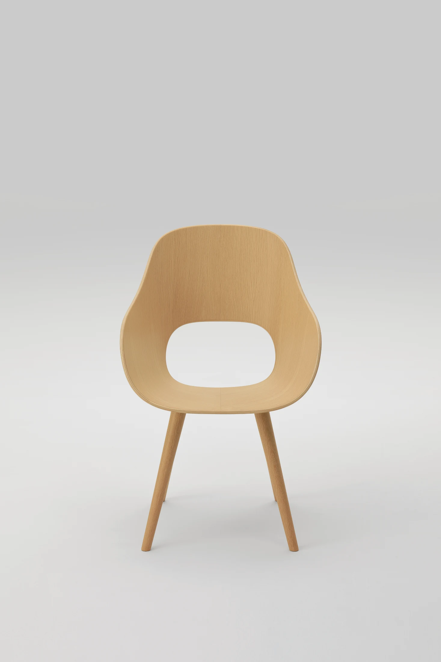 The Roundish Arm Chair designed by Naoto Fukasawa for Maruni gently wraps around the body for maximum comfort. Image: Yoneo Kawabe.