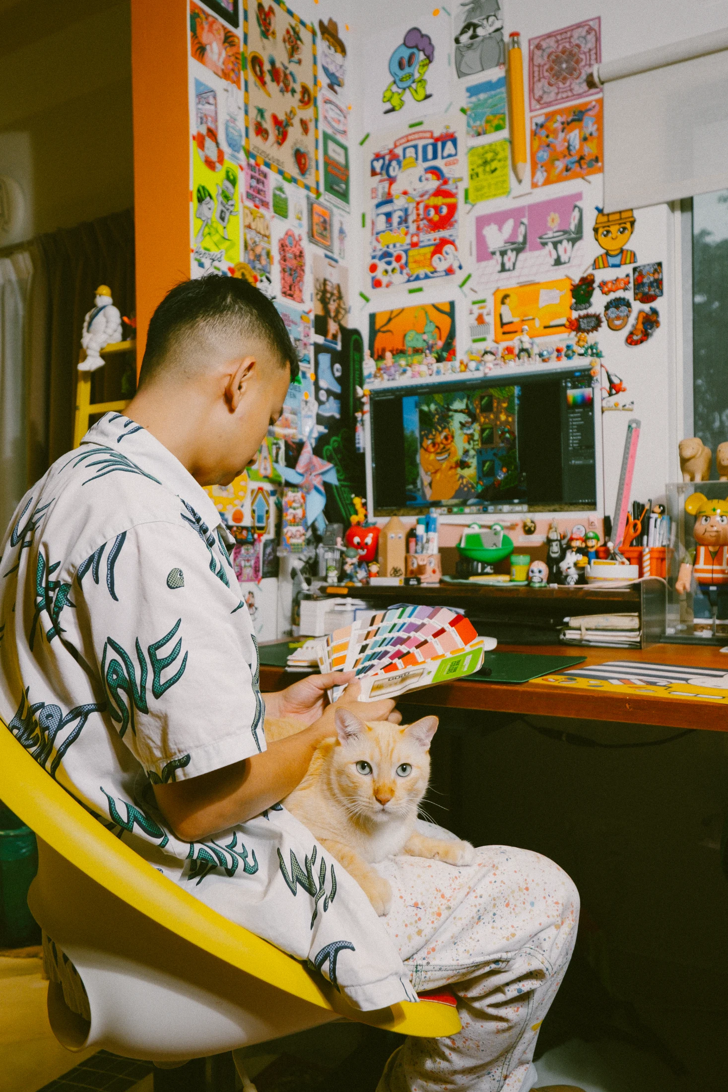 Chern at work in his studio working on colour selections. Image: Auni Athirah Azmi.