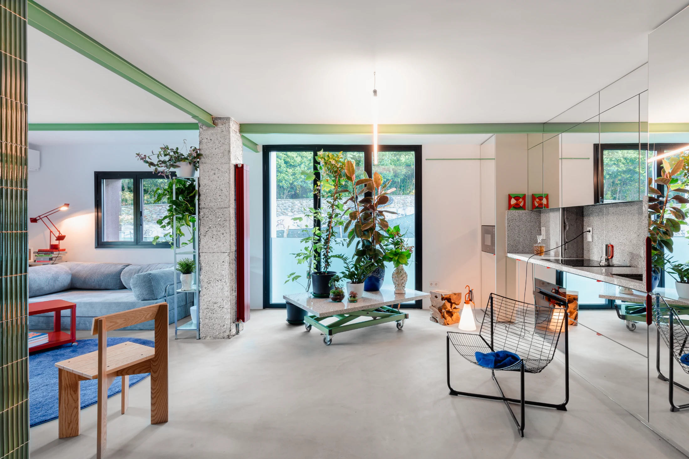 A height adjustable table on castors also doubles as a plant stand to allow house plants to be easily relocated. Image: hiperfocal.