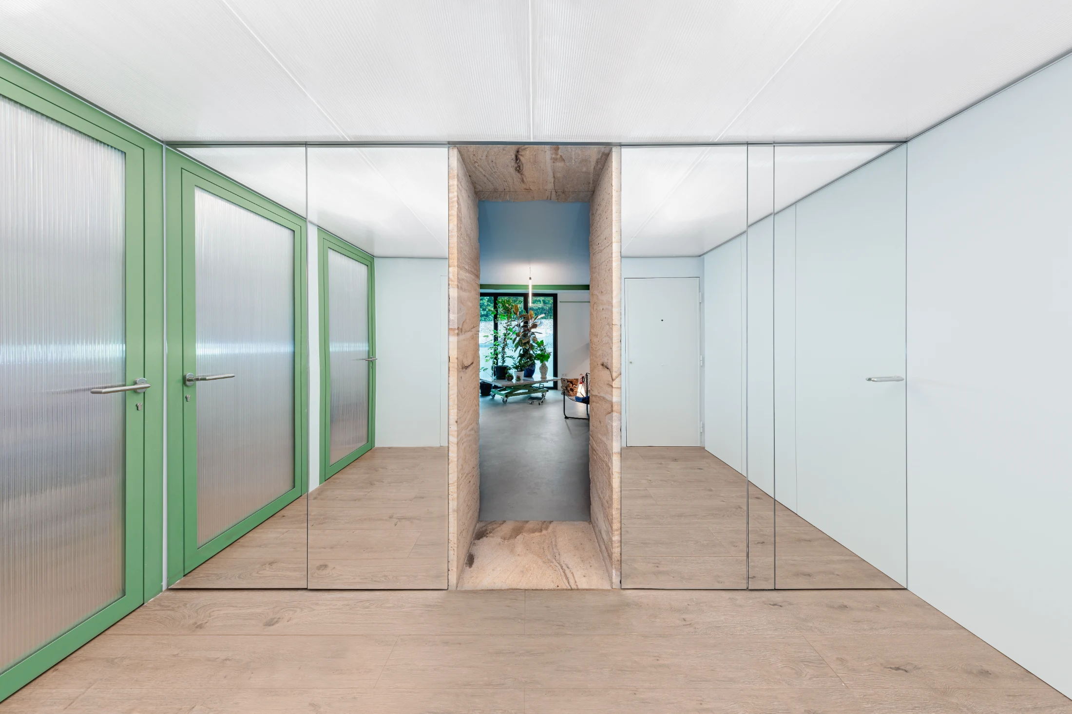 The depth afforded by the 175 degree radial curved wall allows for generous storage and a small guest toilet accessed via these mirrored doors. Image: hiperfocal.