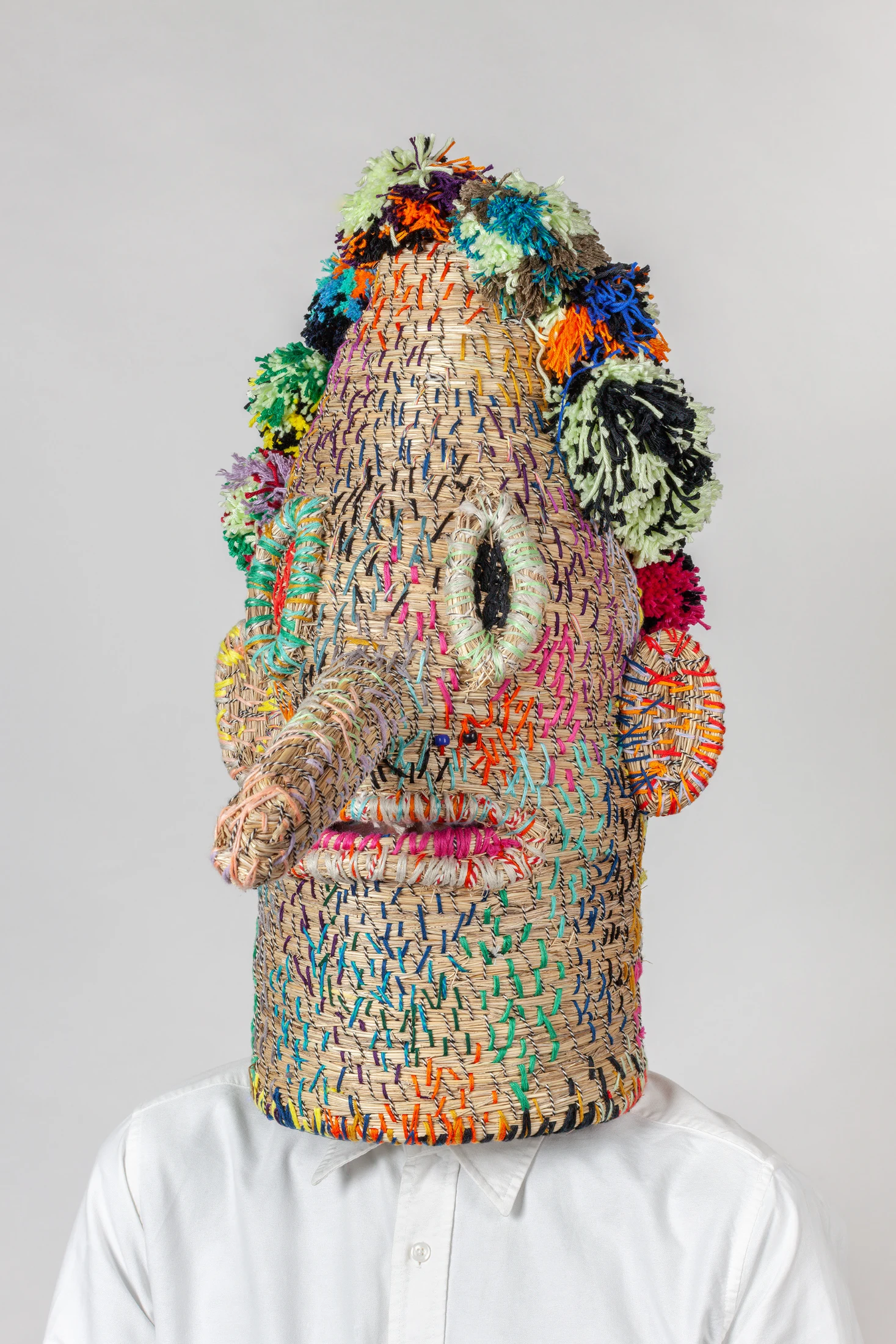 After making masks from synthetic rope and yarn for years, Pot began using grass for his designs in his 2021 Grass Masks collection. Image: Marjolein Fase.