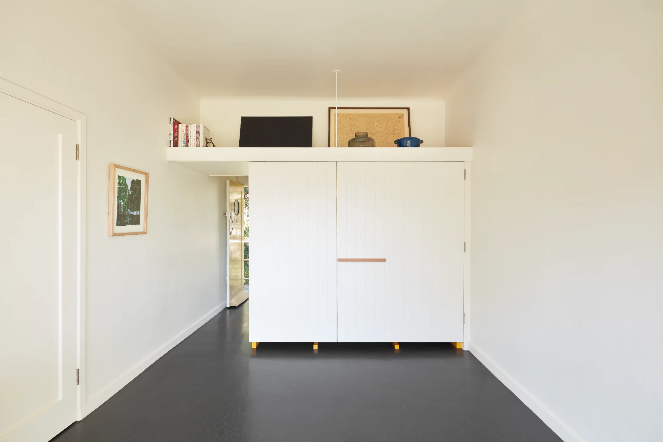 Brad Swartz's kitchen design for Basement Apartment was all about making the kitchen look like a piece of furniture. The kitchen cabinets and worktop are raised on slimline legs, which not only helps it to read as an elegant piece of joinery rather than a