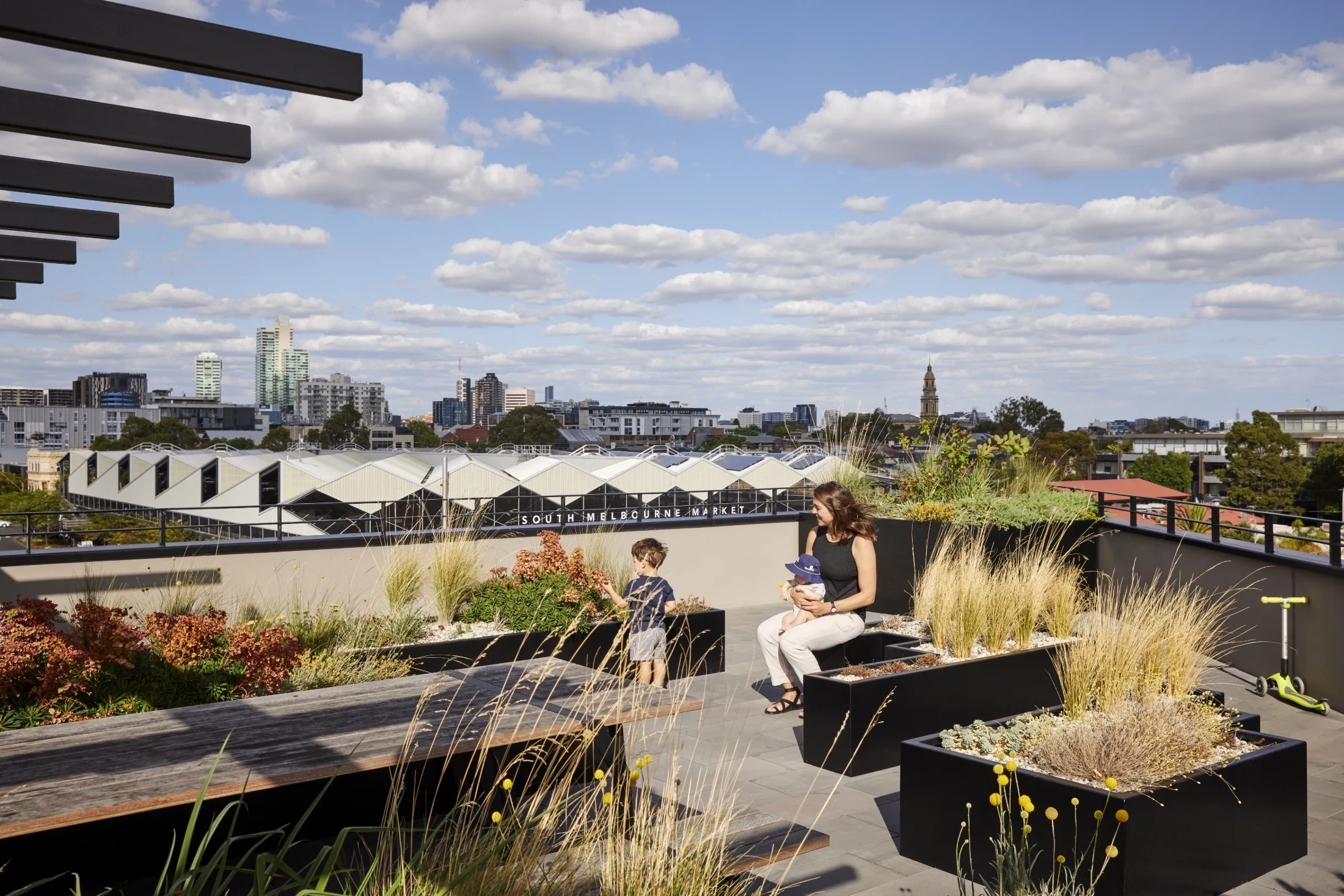 Katya Crema, Liam's partner and their two sons back in 2021 on the rooftop of Ferrars & York where they lived at the time. Photo: Tess Kelly.