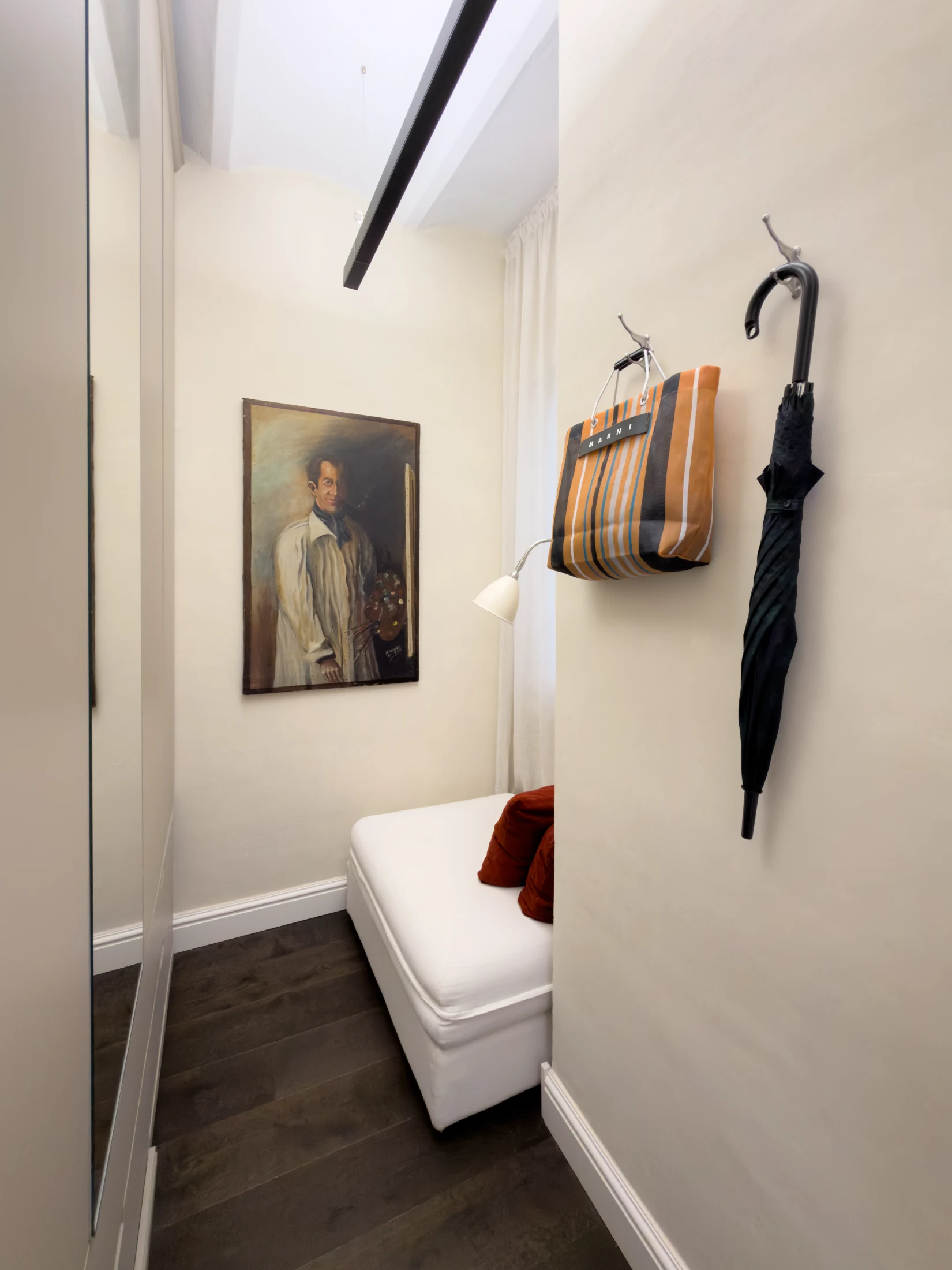 The 'small bedroom' doesn't look like much of a bedroom, but a compact fold-out bed makes it a cosy and welcoming space for guests to stay.