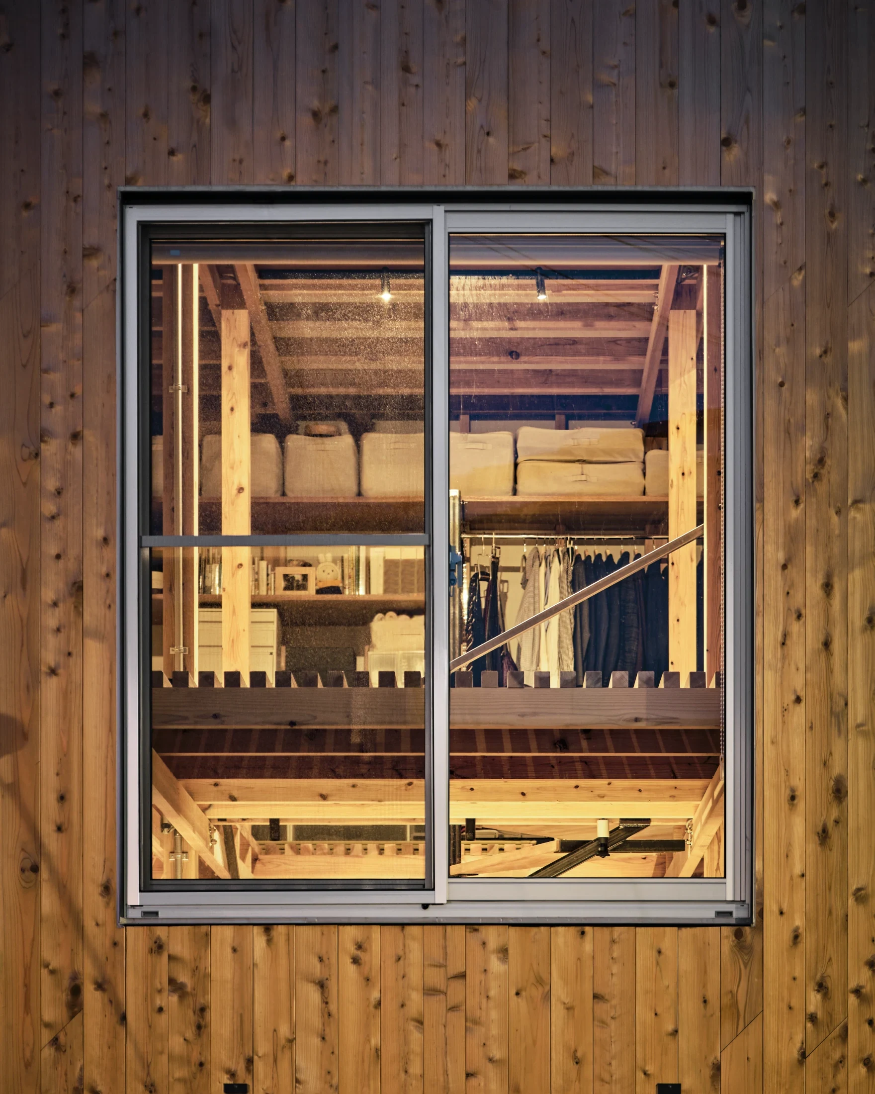 By positioning the windows midway between the first and second floors, they contribute to the environment on both levels.