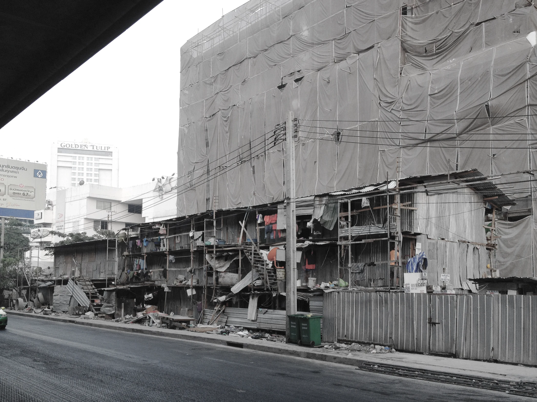 Makeshift accommodation for construction workers at a Bangkok condominium development. Image: Chat Architects.