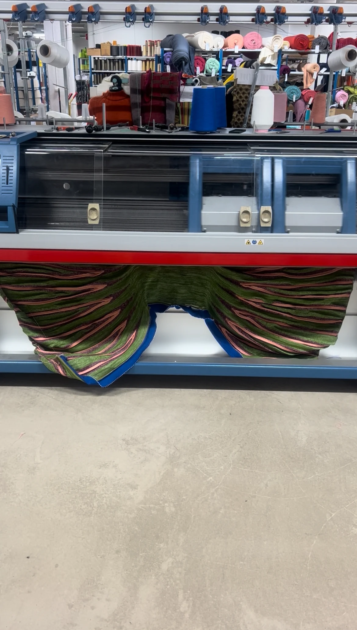 The workshop and flatbed knitting machine Luna uses to knit her creations. Image: Luna Haverkorn.