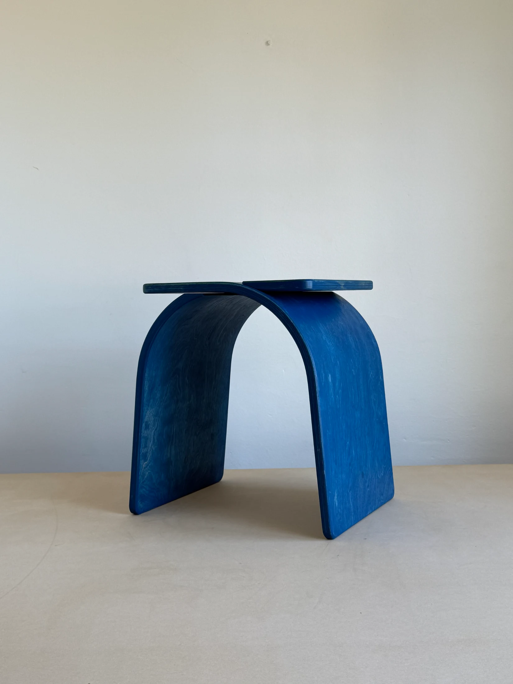 Nude Modular's Butterfly Stool made from two interlocking pieces of plywood.