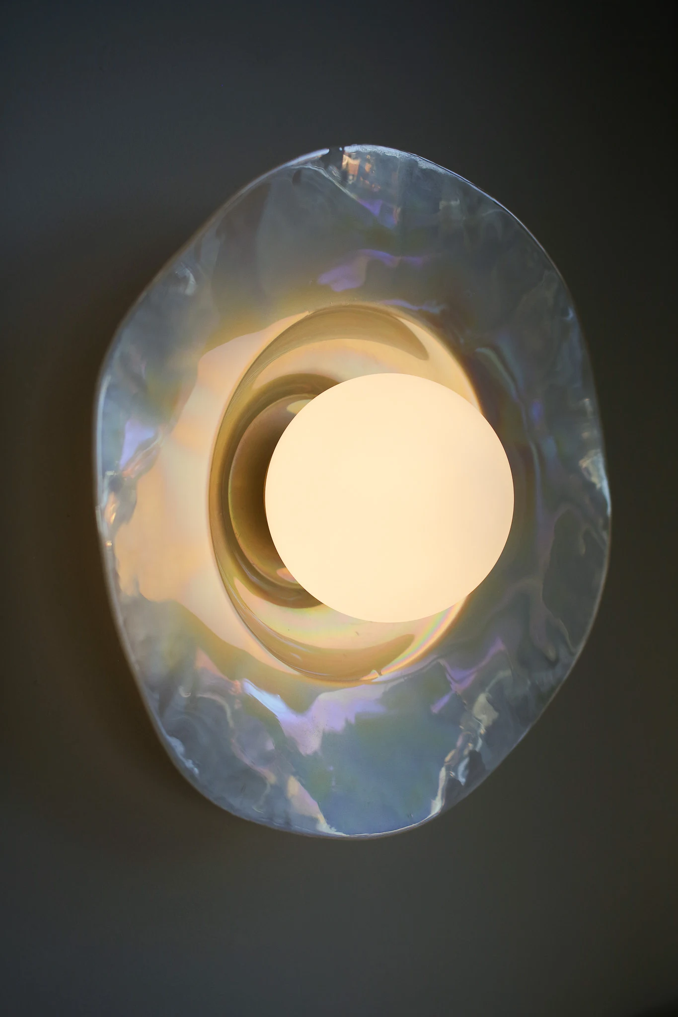 Pearlescent Sconce made from an iridescent plate.