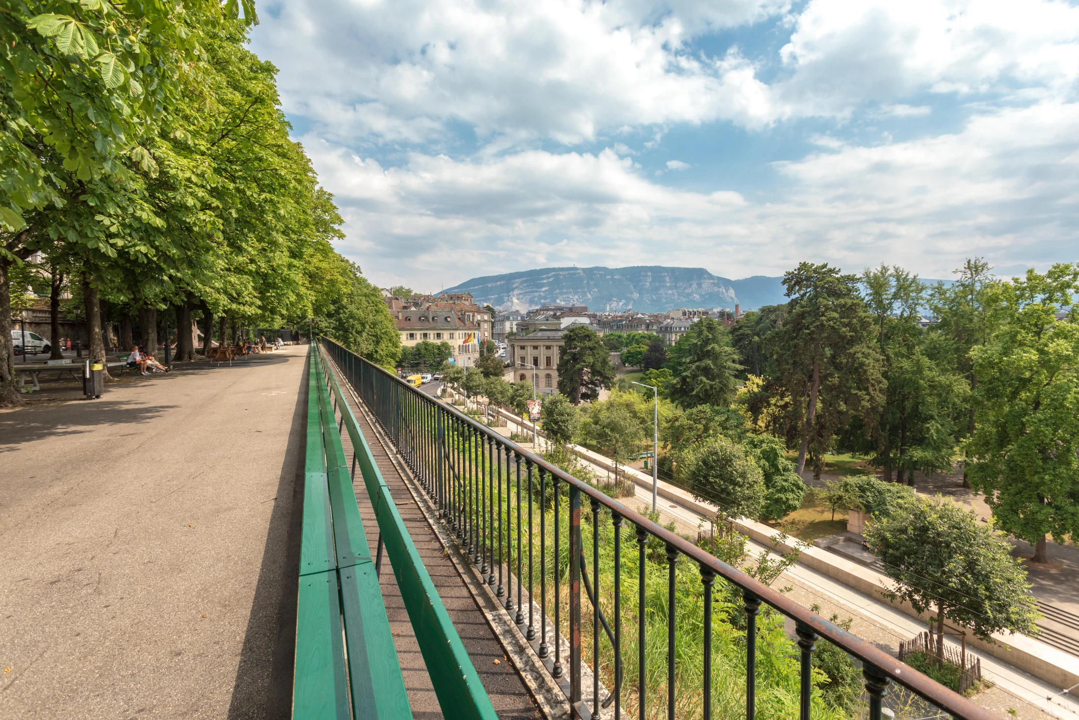 The wooden bench in Geneva that stretches for 120 metres along the chestnut-tree-lined Promenade de la Treille. Image: Cristian Mihaila / Alamy Stock Photo.