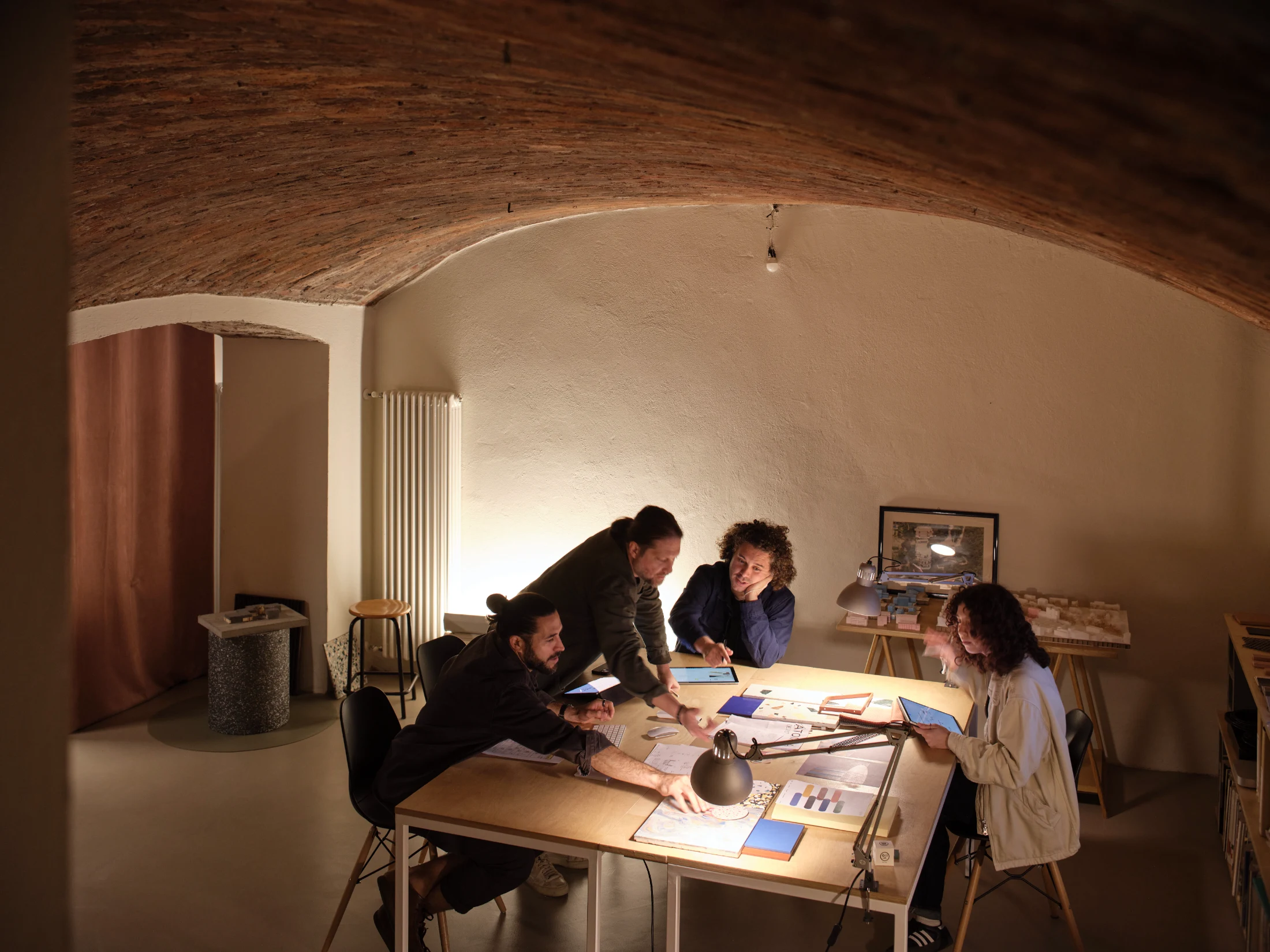 The dramatic brick-vaulted ceiling of ATOMAA's basement meeting spaces in the renovated 19th century stables that house their offices.