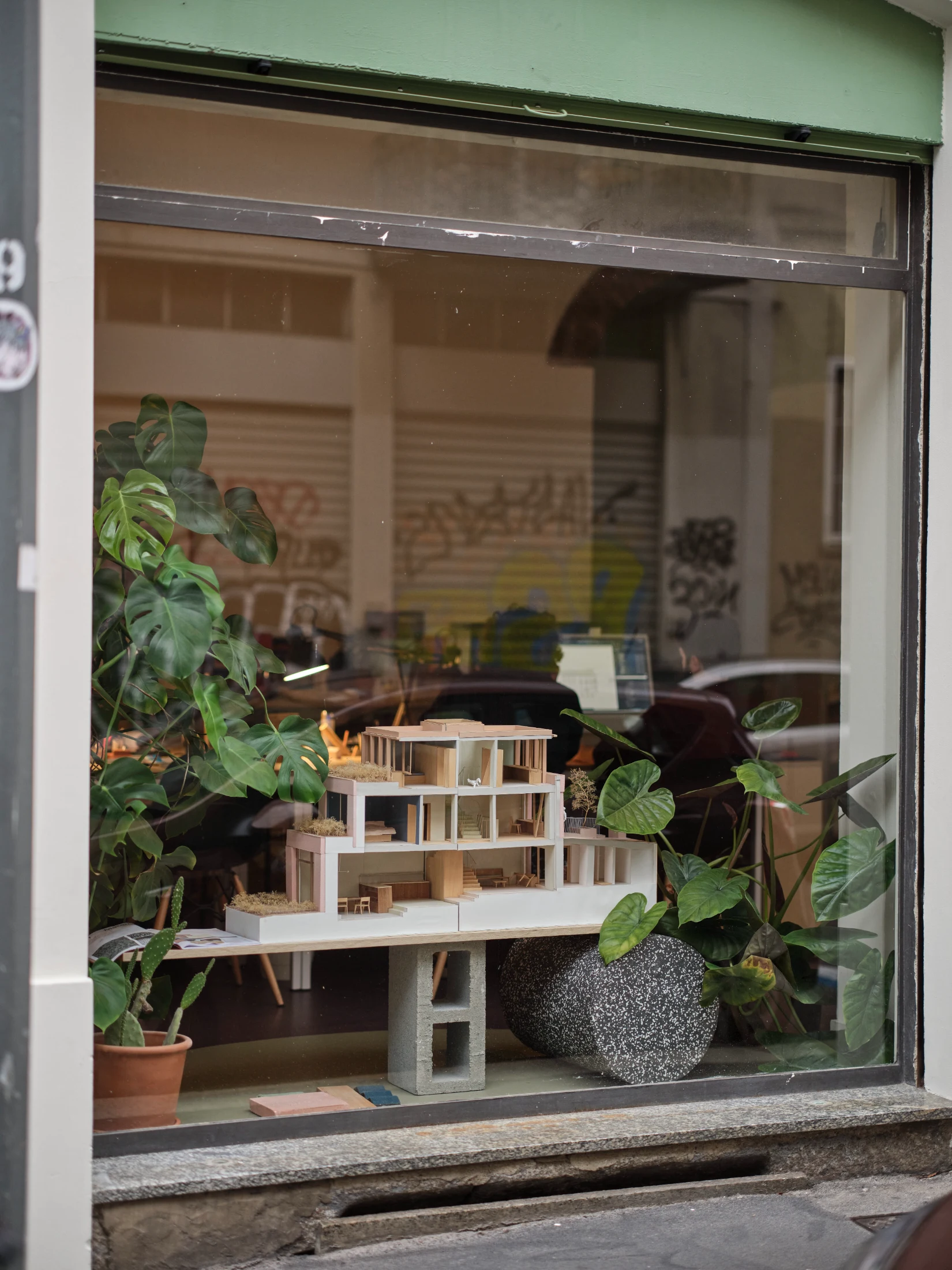One of the handsome and painstakingly crafted architectural models on display in a window of ATOMAA's office.