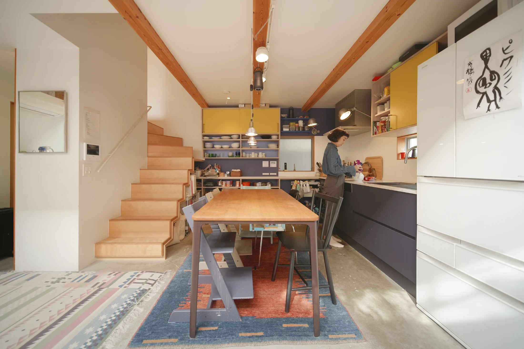 The generous L-shaped kitchen includes full-sized appliances and plenty of storage and bench space for the family of five.