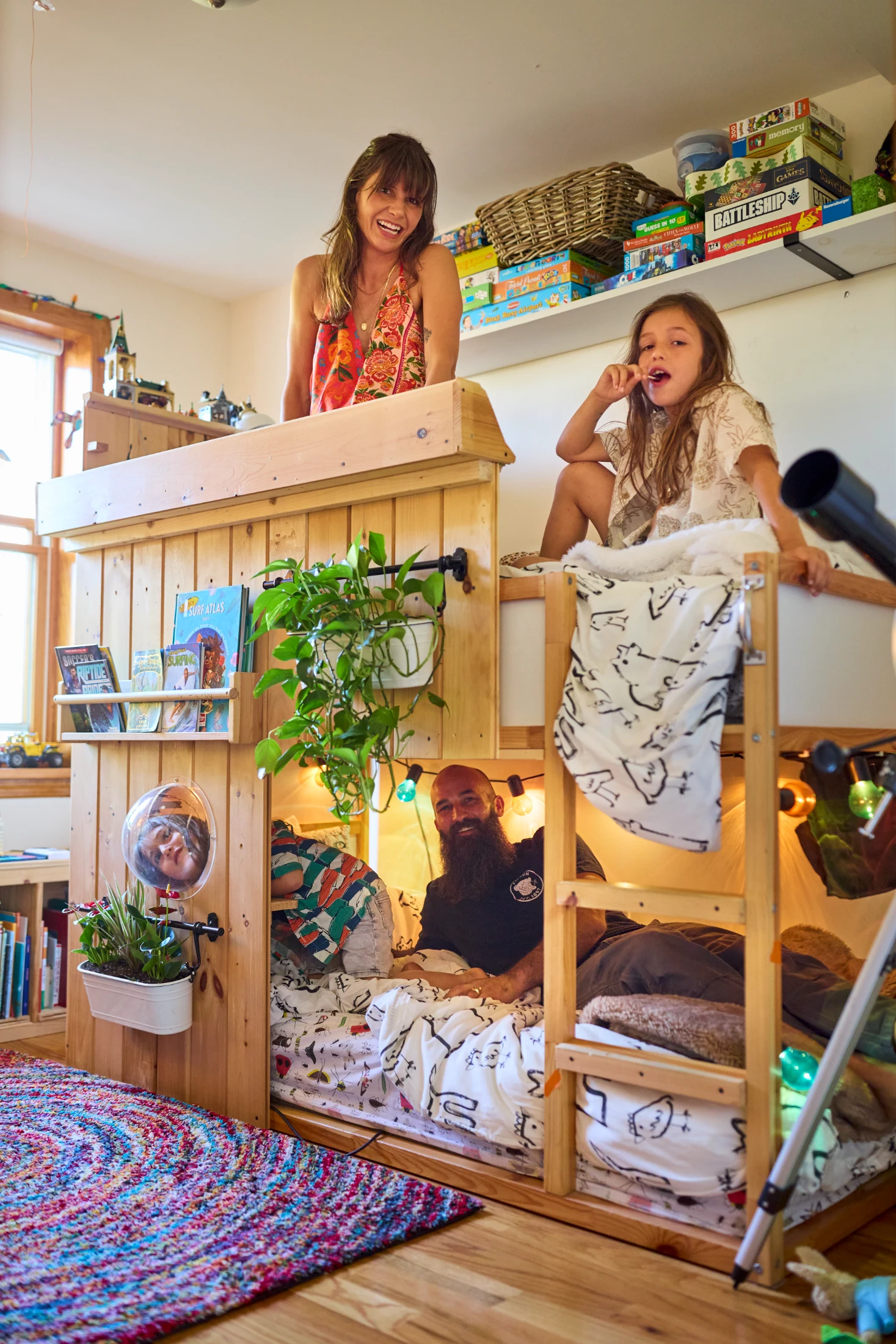 Parents Katherine and Eric are pictured with their children Clay and Julian on the bunk bed of dreams – complete with planter boxes and bubble window. This creative and fascinating family are typical of those Todd features in his new book.
