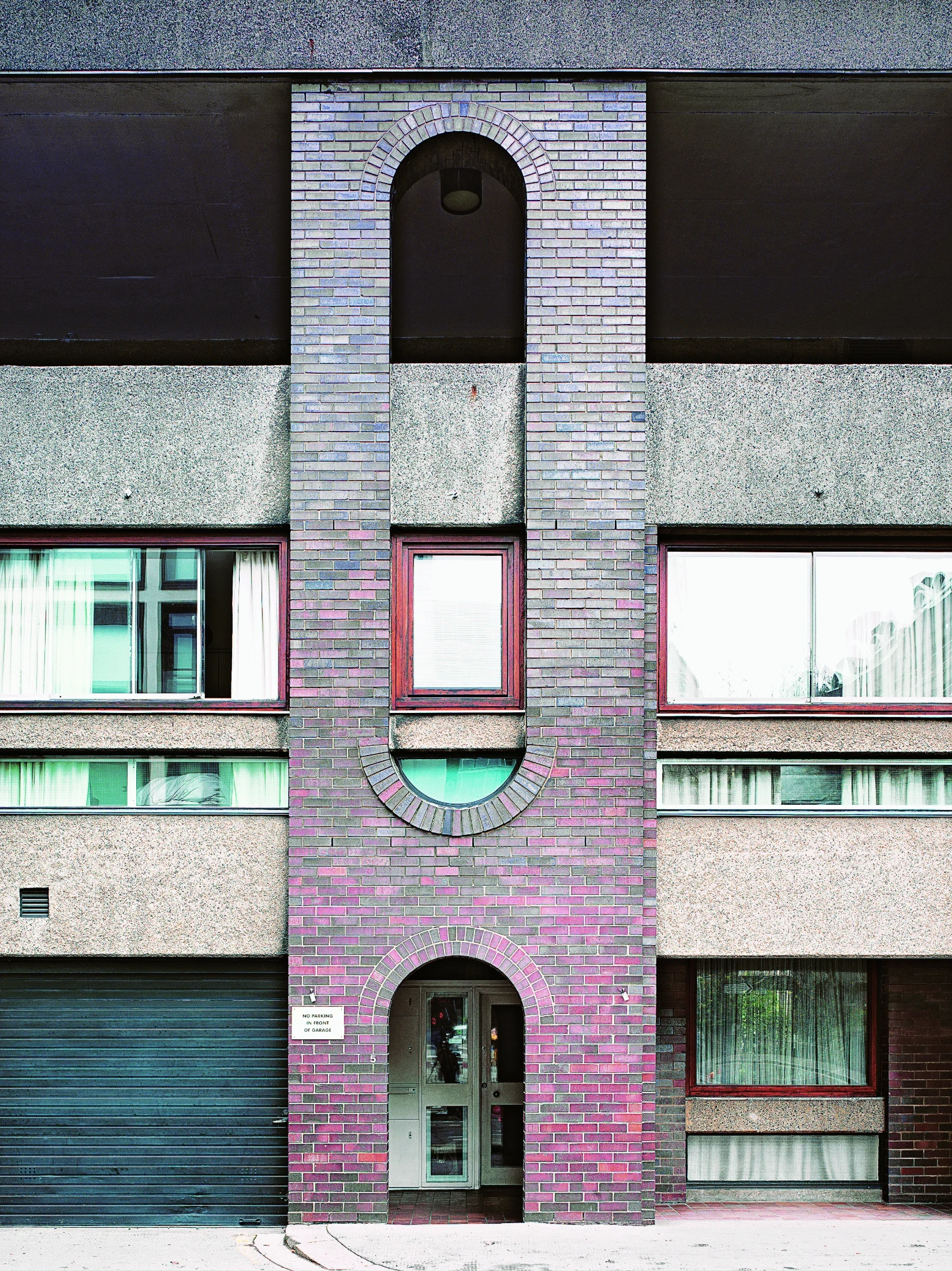 As a contrast to the pick hammered concrete of the buildings, the architects used 'earth coloured' tiles and bricks to pave the podium and other hard-paved open areas and the buildings below podium level are faced in semi-engineered bricks of the same colo