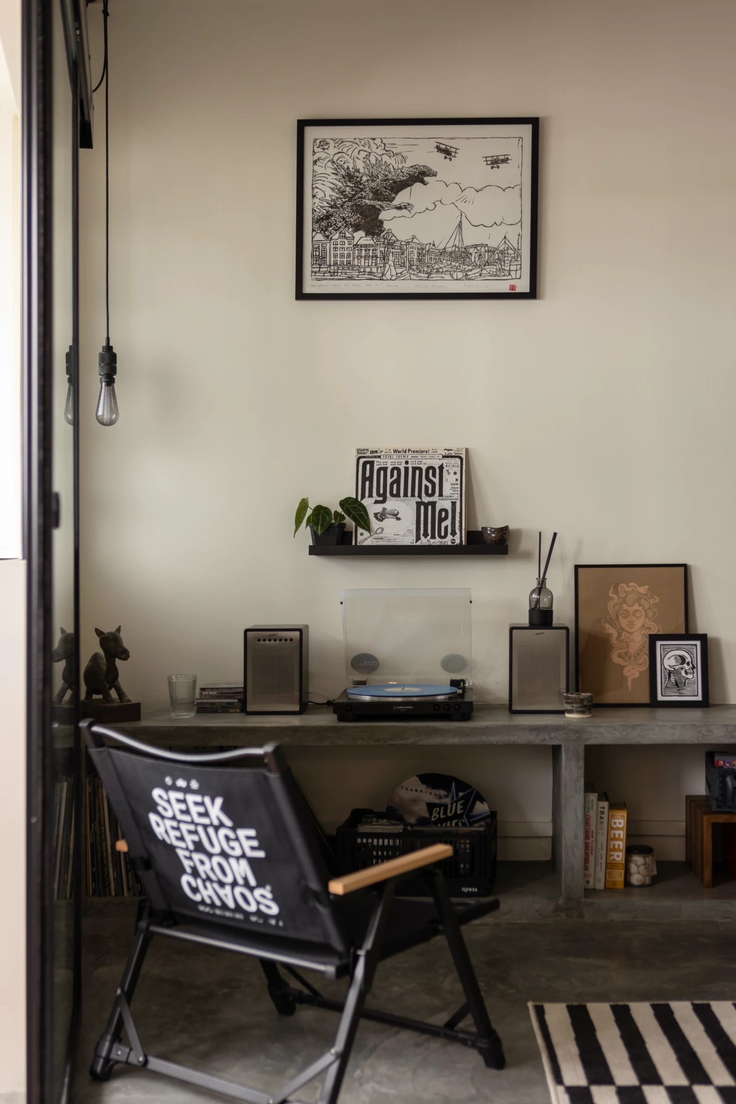 A raw concrete TV console that could store Vin's vinyl collection while accommodating his turntable and sound system was a key part of his brief.