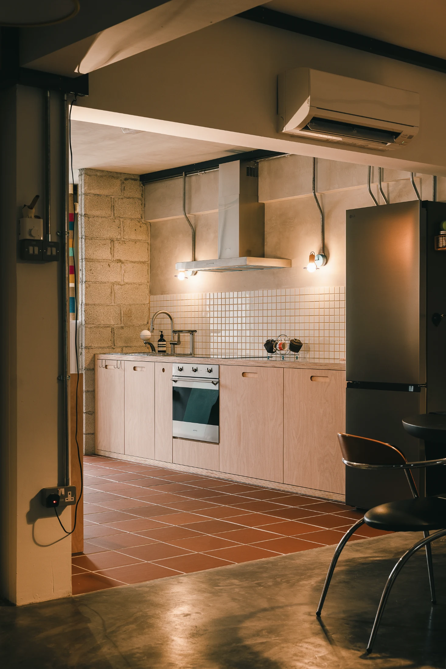 Feature lighting has replaced the typical overhead cabinets with their