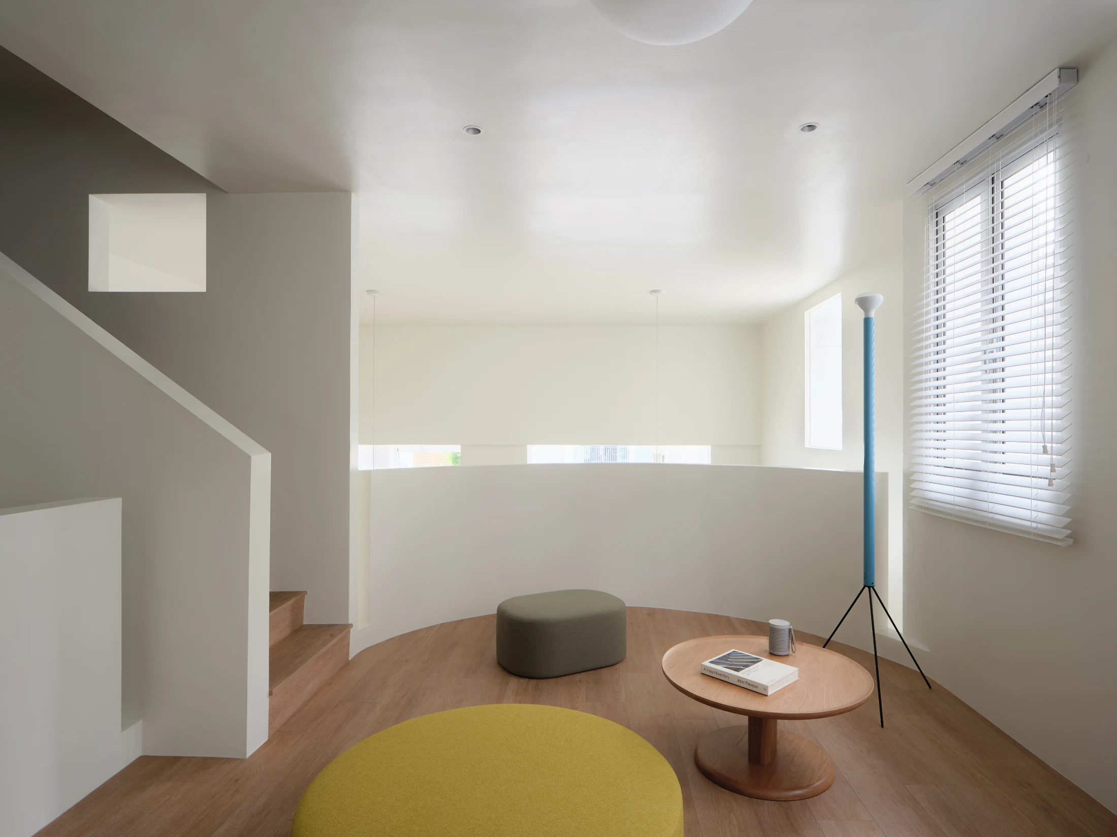 Grove View House (2025) with its cylindrical volumes and cut openings, featuring Studio Juju's Tray Table (2024). Image: Fabian Ong.