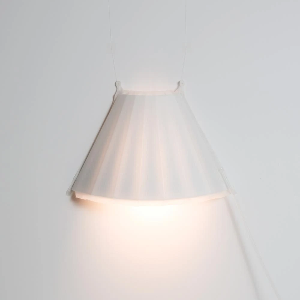 Made from simple 2D outlines, Lumin(Air) is a wall-mounted lamp that emerges from a flat wall into a 3D form when inflated. Image: E Ian Siew.