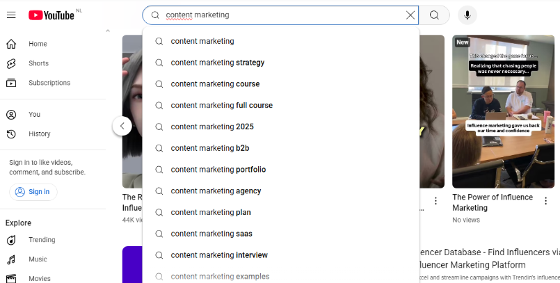 A YouTube search bar with “content marketing” typed in, showing autocomplete suggestions like “content marketing strategy,” “content marketing course,” “content marketing 2025,” “content marketing b2b,” and “content marketing plan.”