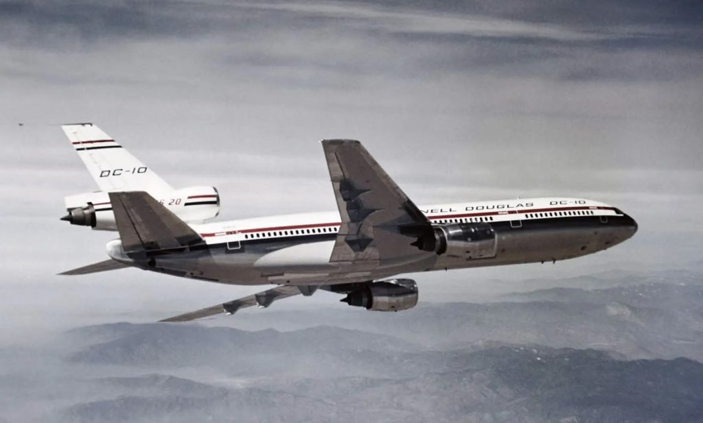 McDonnell Douglas DC-10 Series 20 prototype in flight over mountains during testing