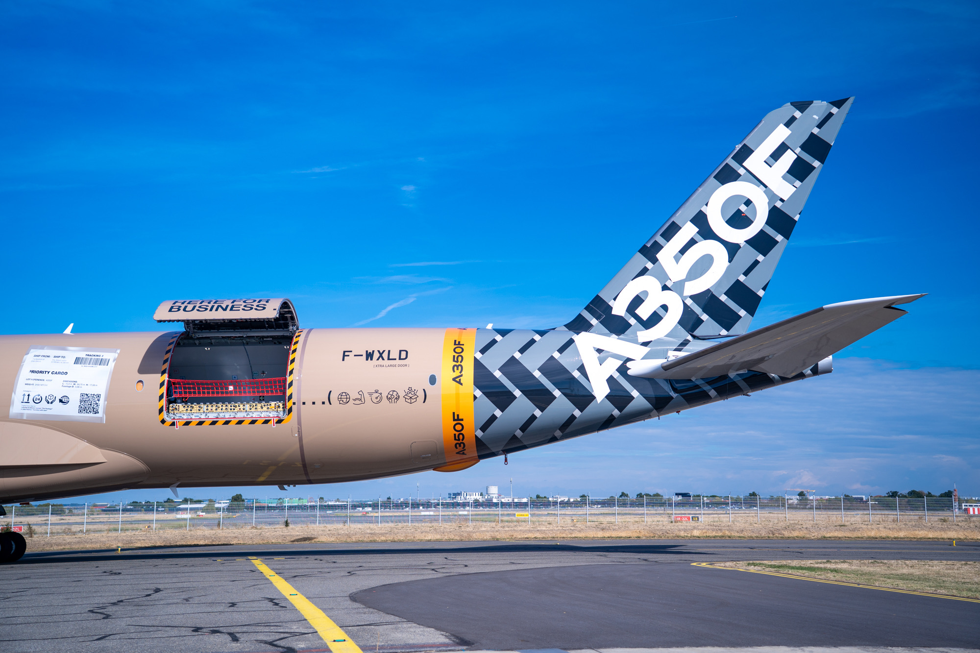 Rear fuselage of the A350F with its cargo door open and A350F tail visible.